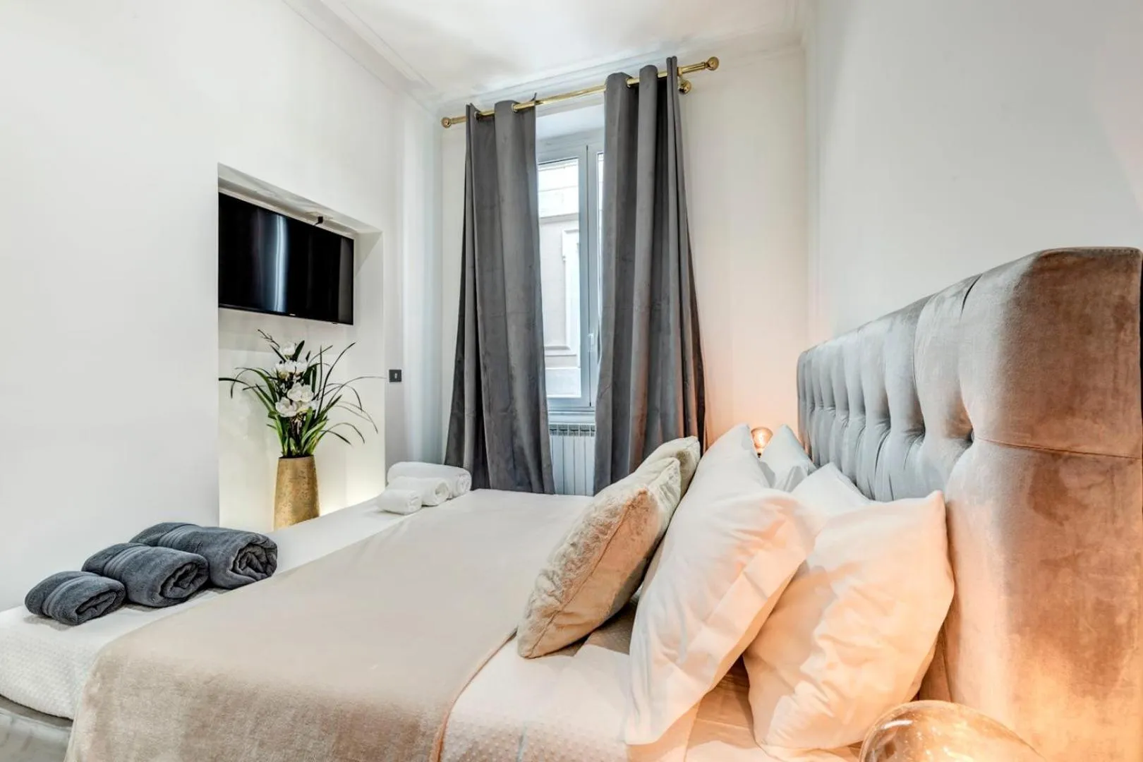 Bed in Daphne Suites