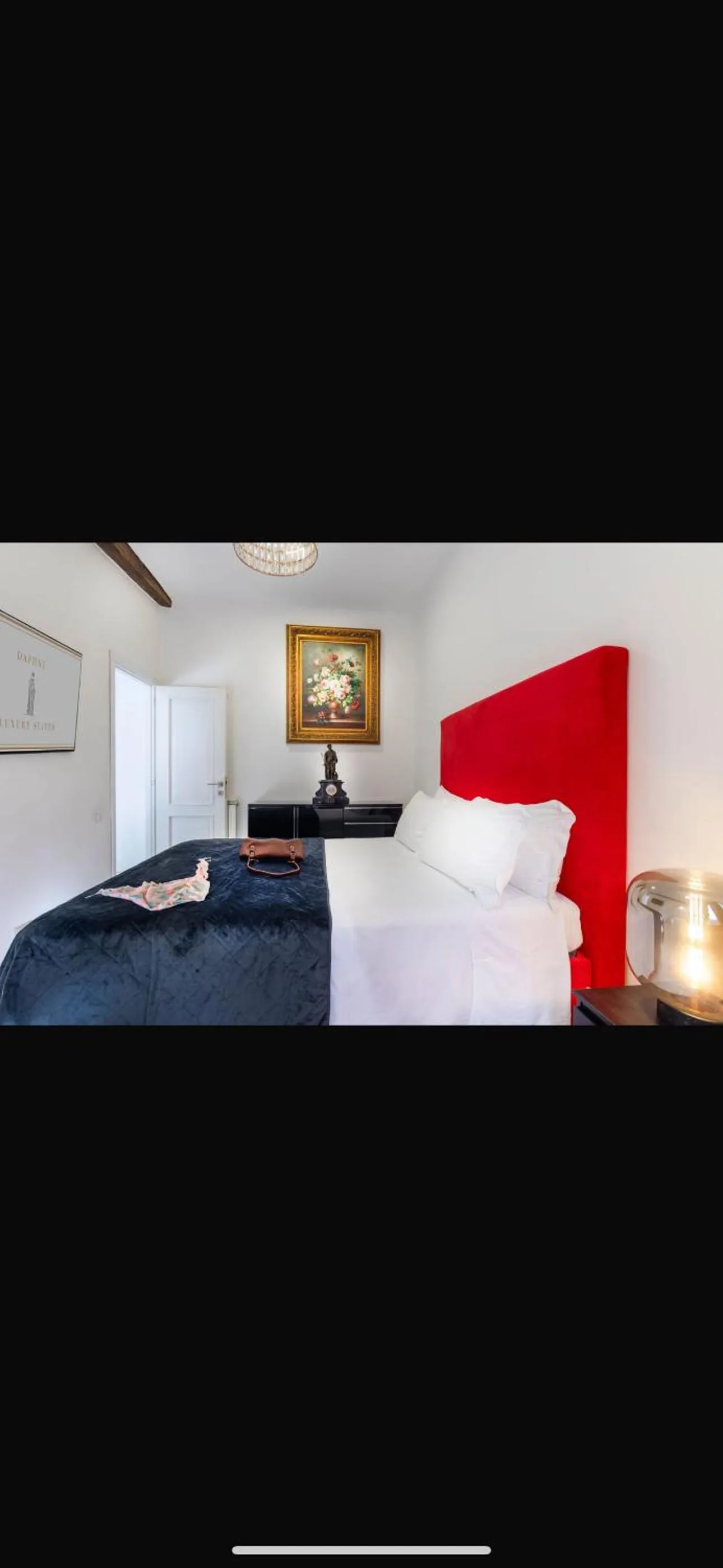 Bed in Daphne Suites