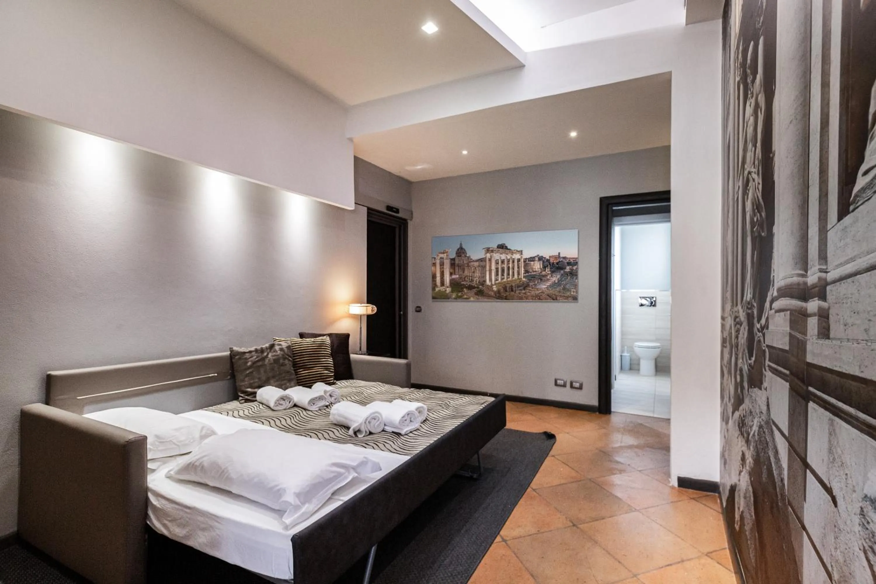 Bed in Daphne Suites