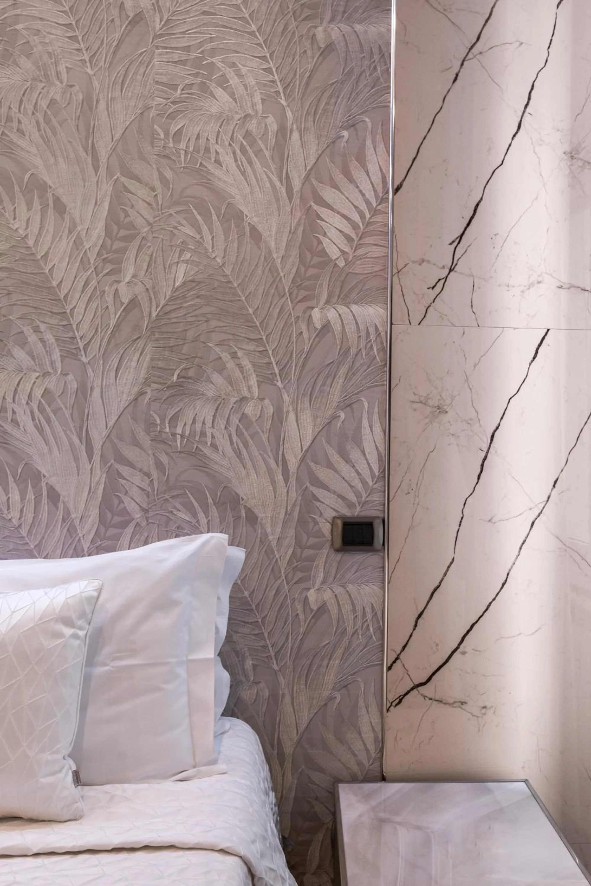 Bed in Daphne Suites