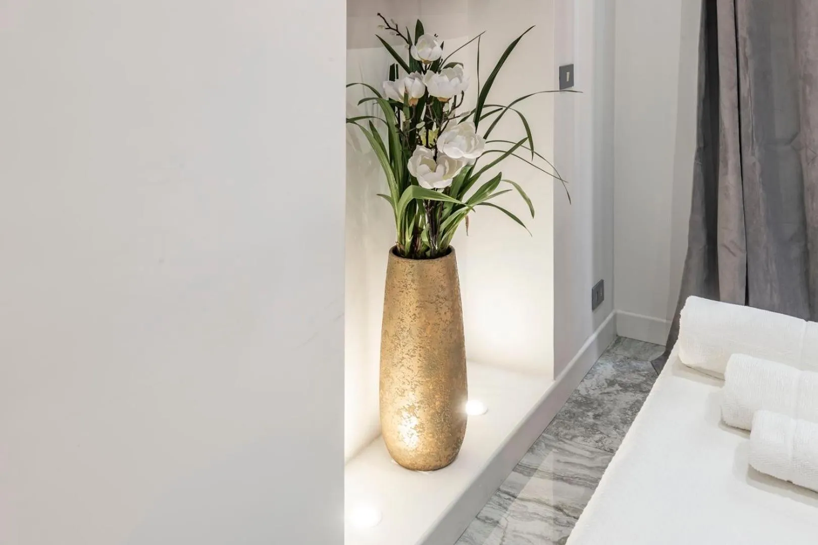 Bed in Daphne Suites