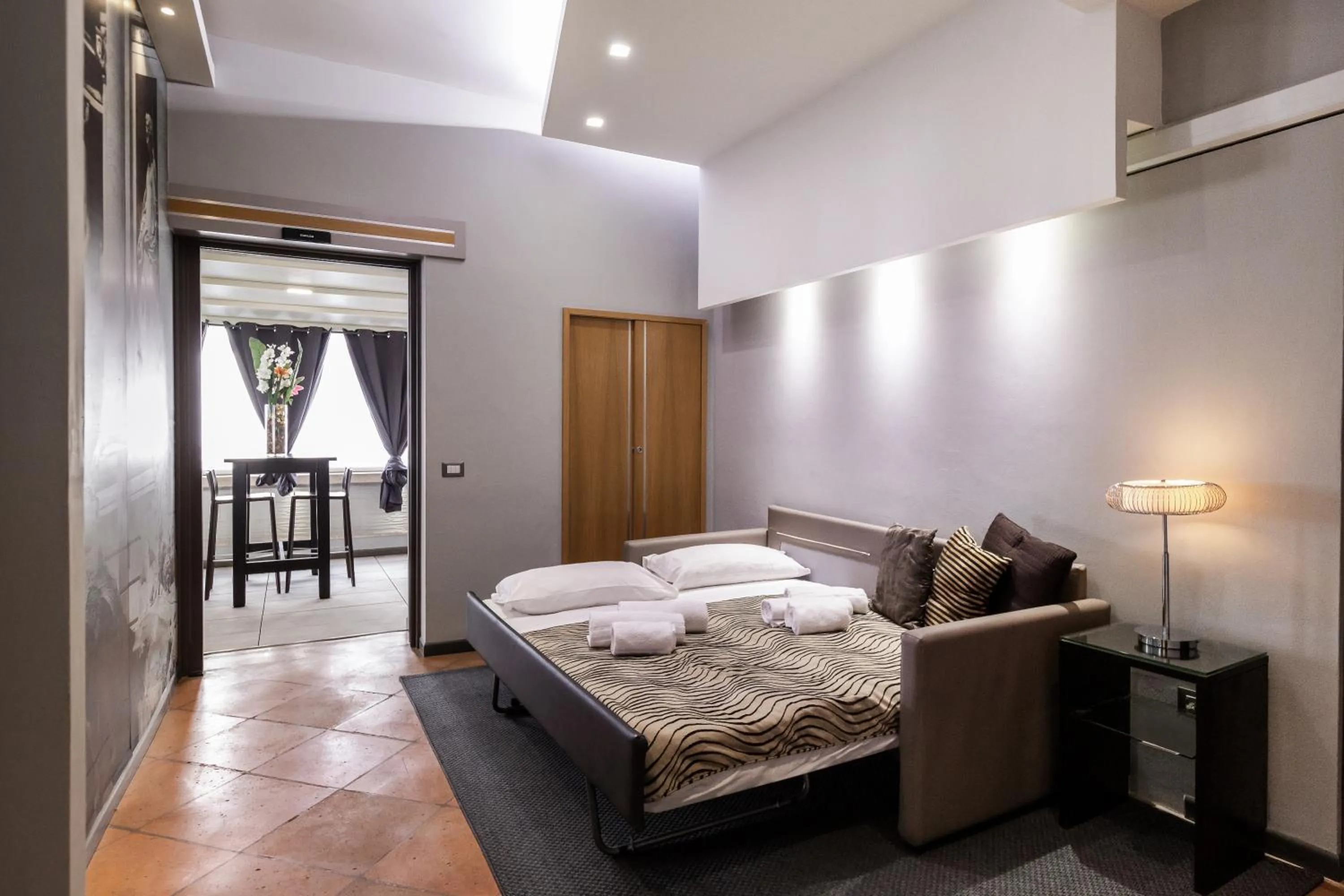 Bed in Daphne Suites