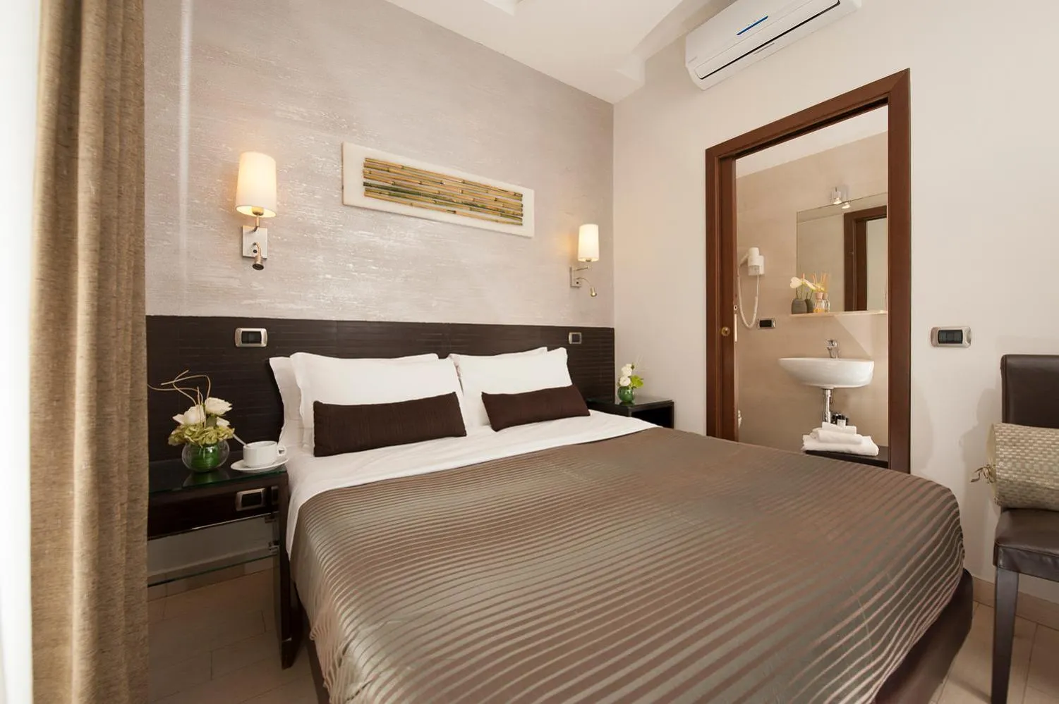 Bed in Daphne Suites