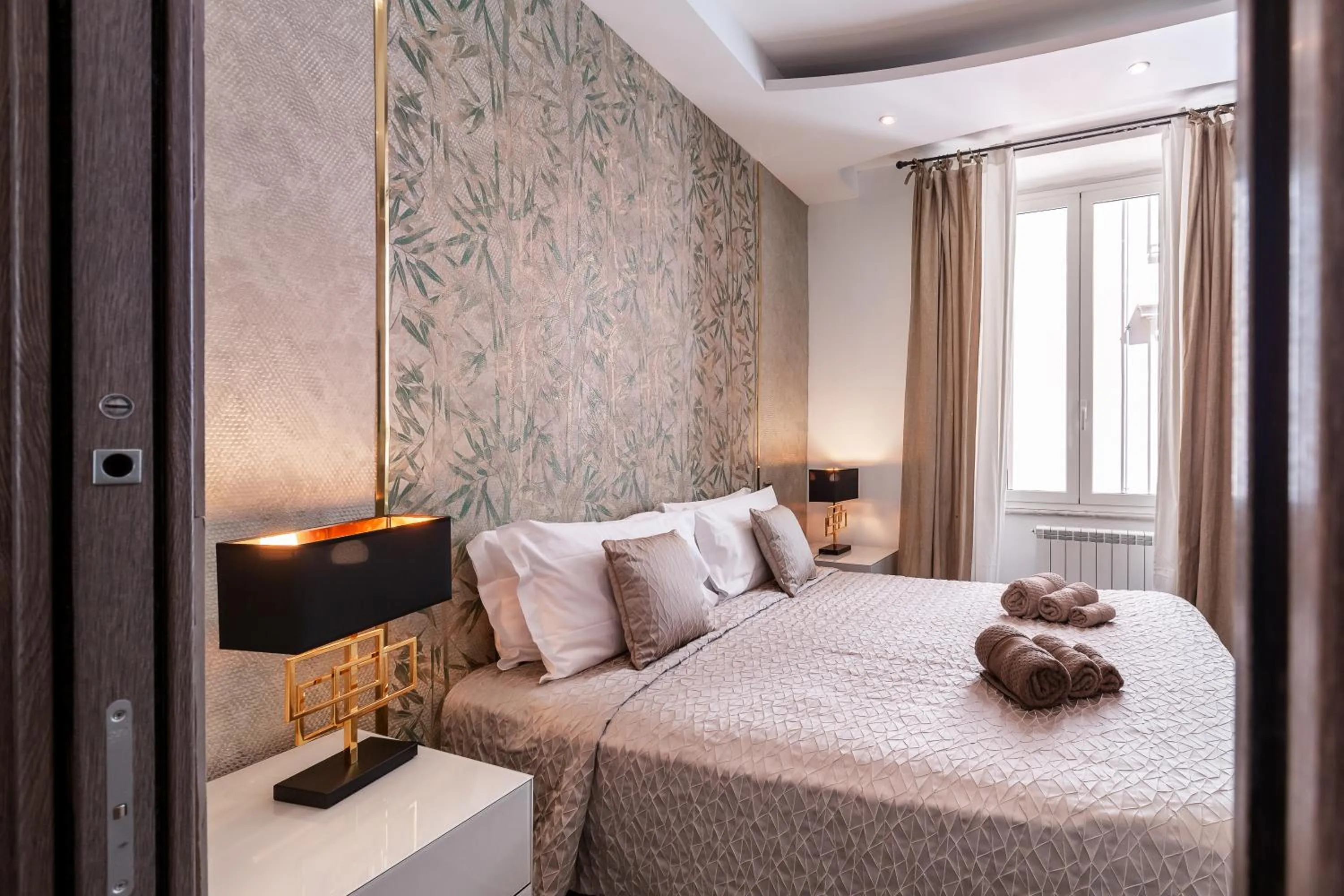 Bed in Daphne Suites