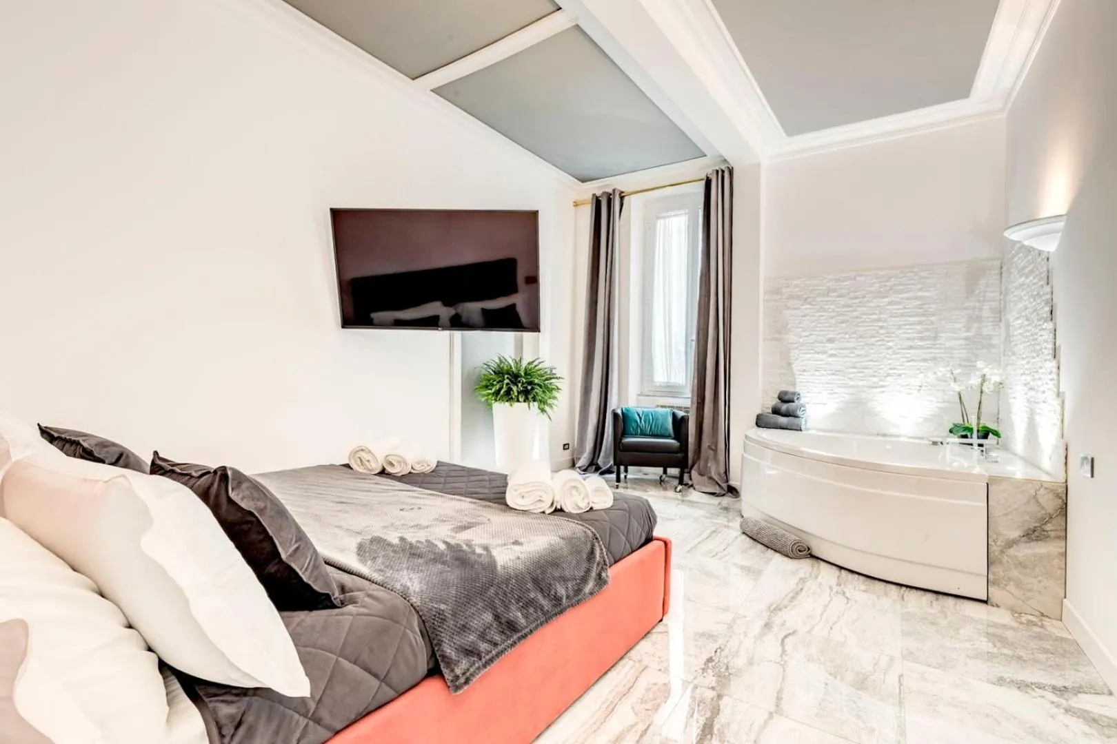 Bed in Daphne Suites