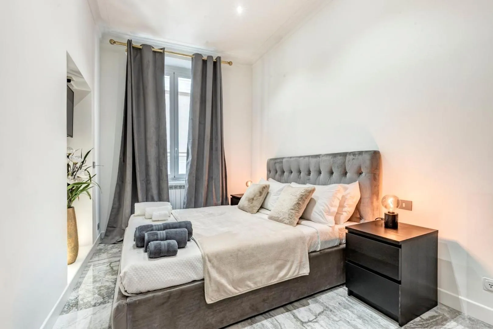 Bed in Daphne Suites