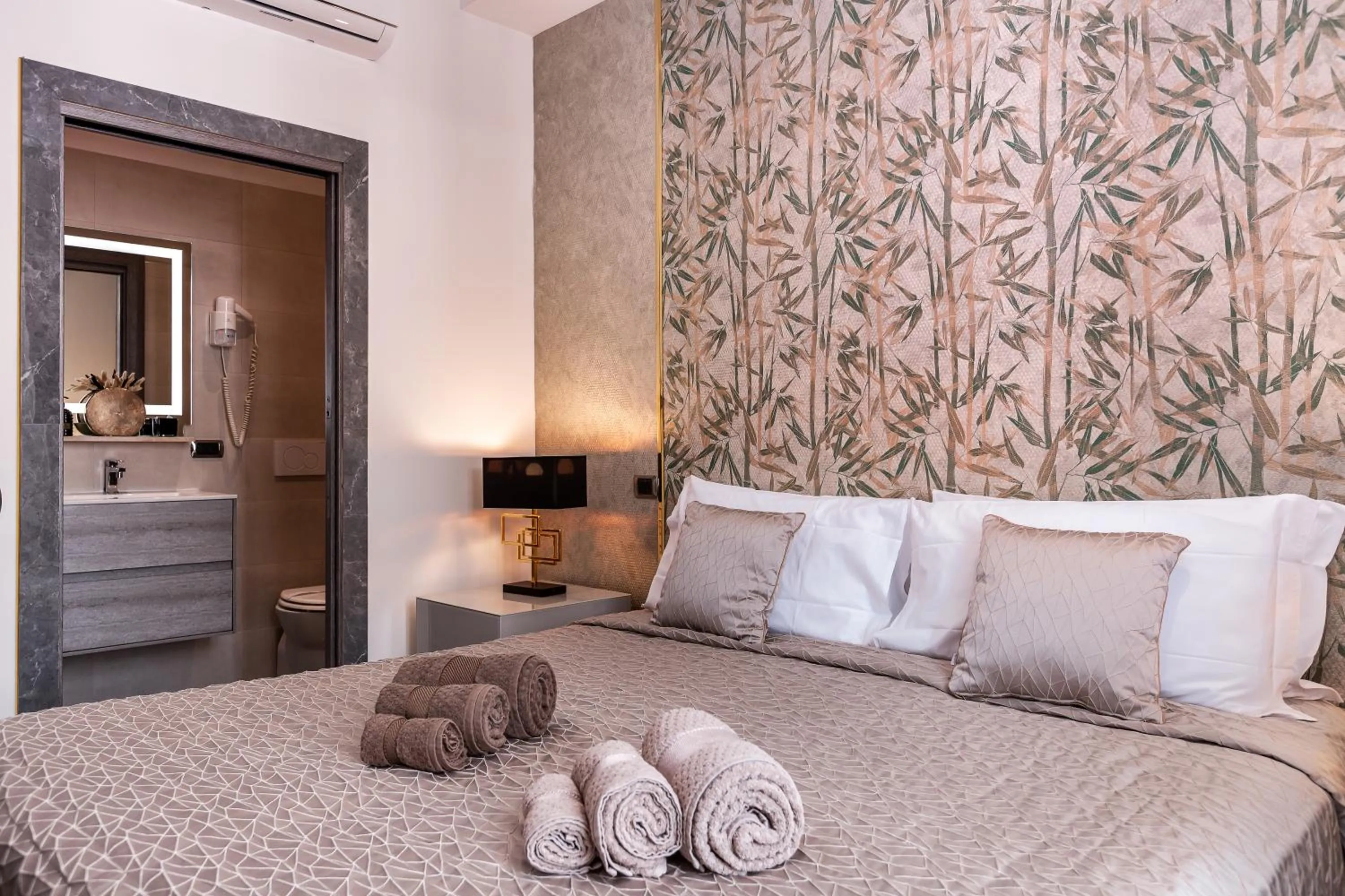 Bed in Daphne Suites