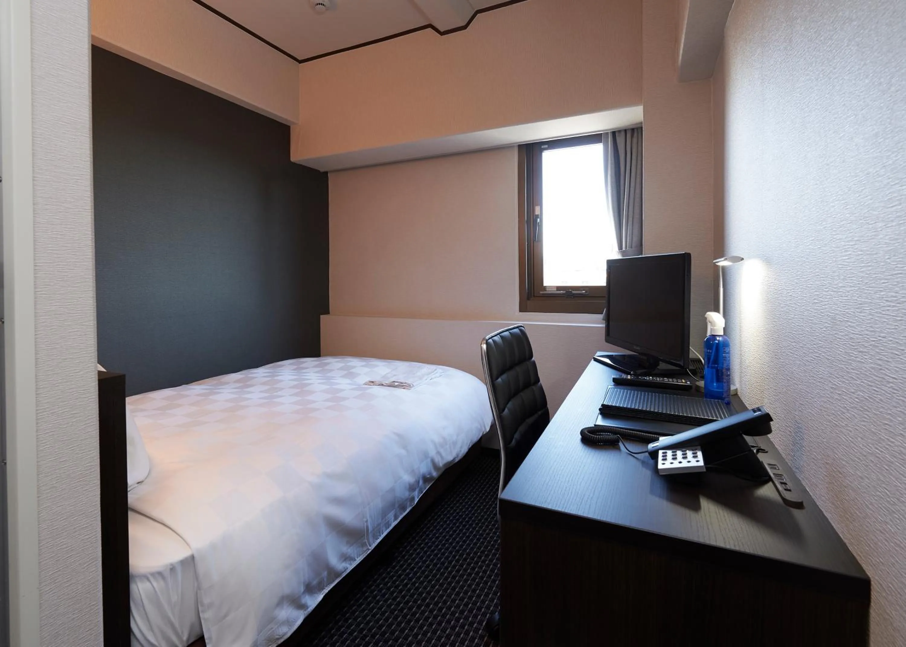 Bed in Hotel Consort Shin-Osaka