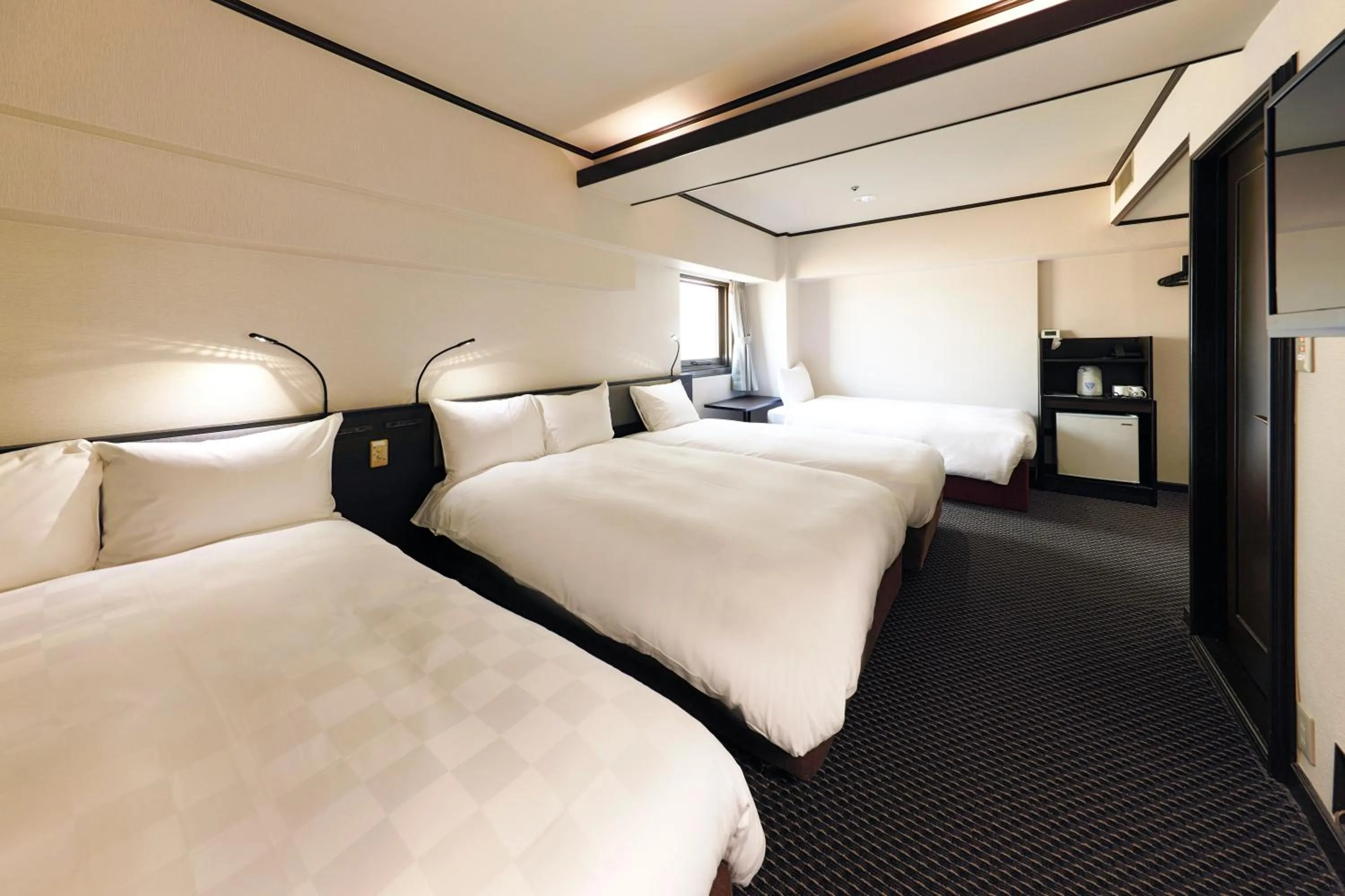 Bed in Hotel Consort Shin-Osaka