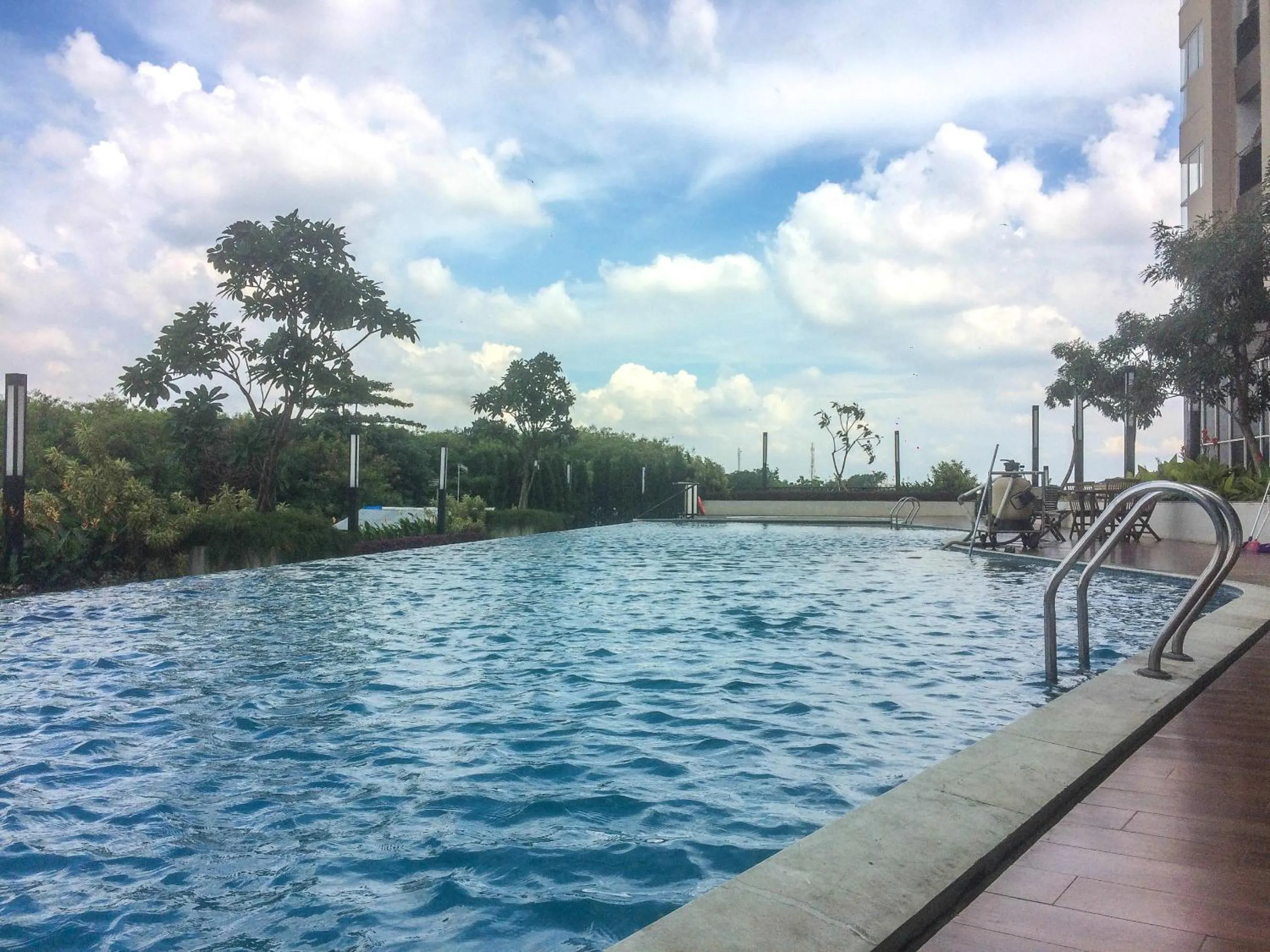 Swimming pool in Strategic Studio The Oasis Cikarang near Omni Hospital By Travelio