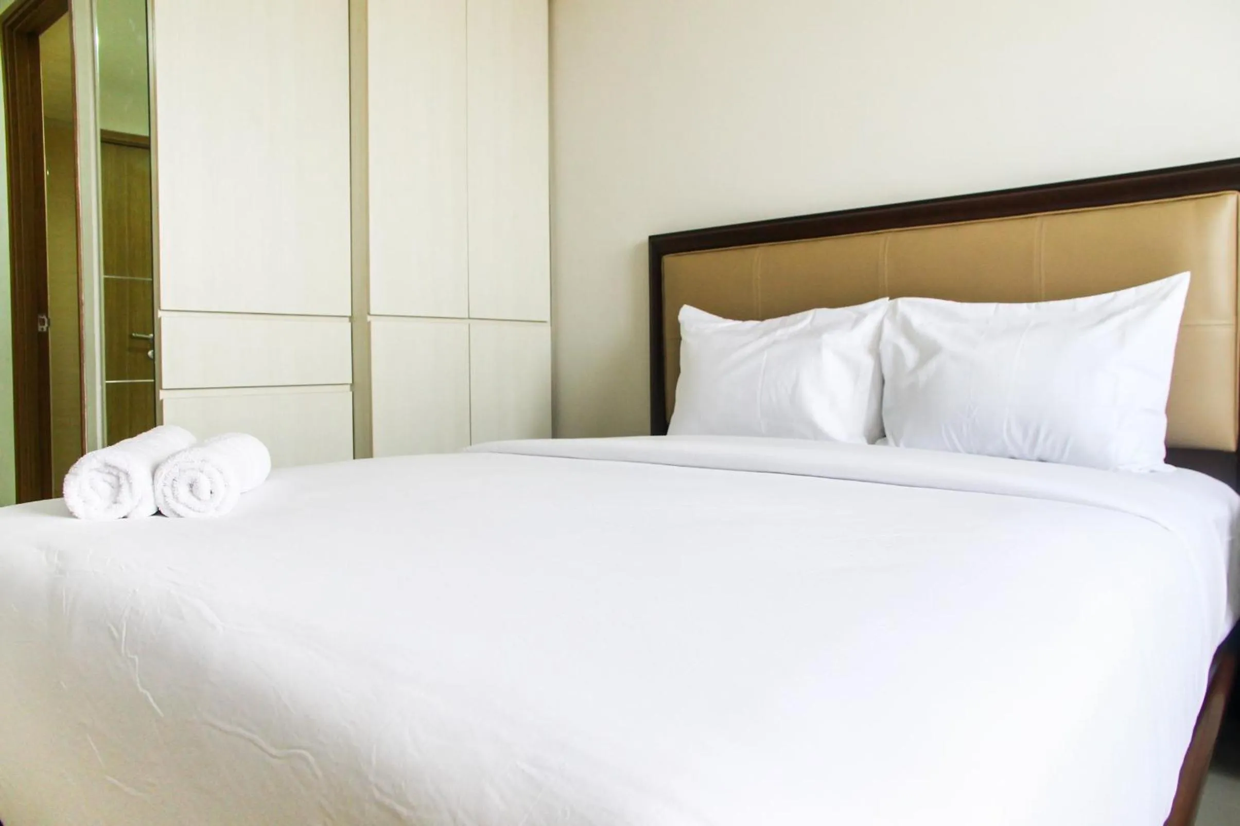 Bed in Best and Homey 2BR Taman Sari Semanggi Apartment By Travelio