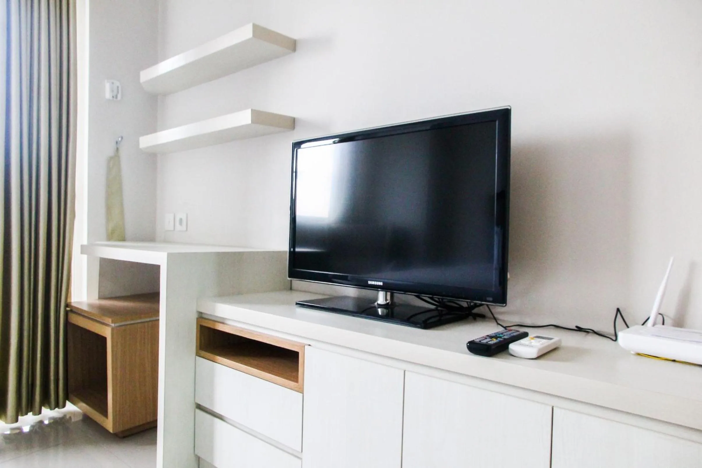 TV and multimedia in Best and Homey 2BR Taman Sari Semanggi Apartment By Travelio