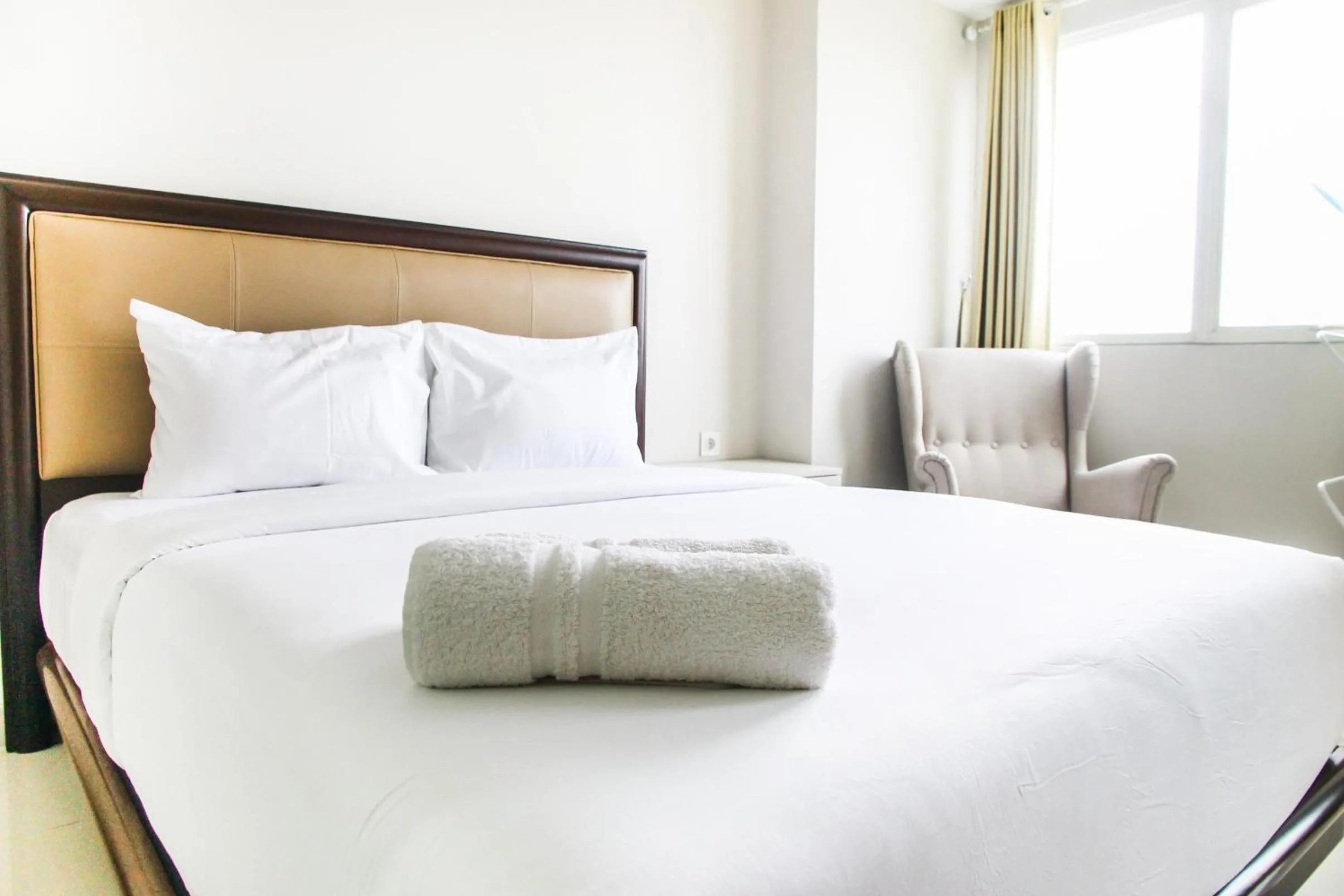 Bed in Best and Homey 2BR Taman Sari Semanggi Apartment By Travelio