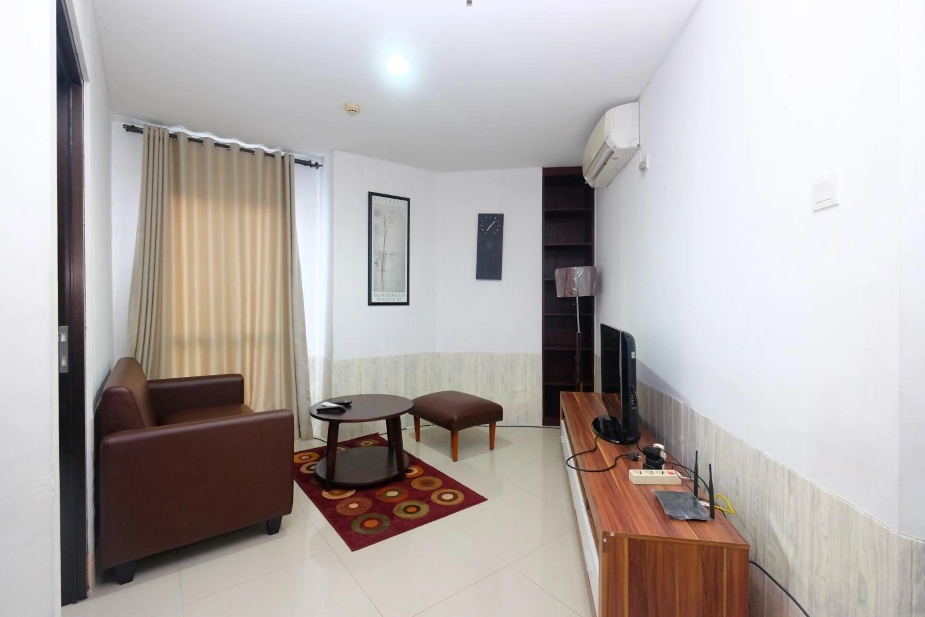 Living room in Best and Homey 2BR Taman Sari Semanggi Apartment By Travelio