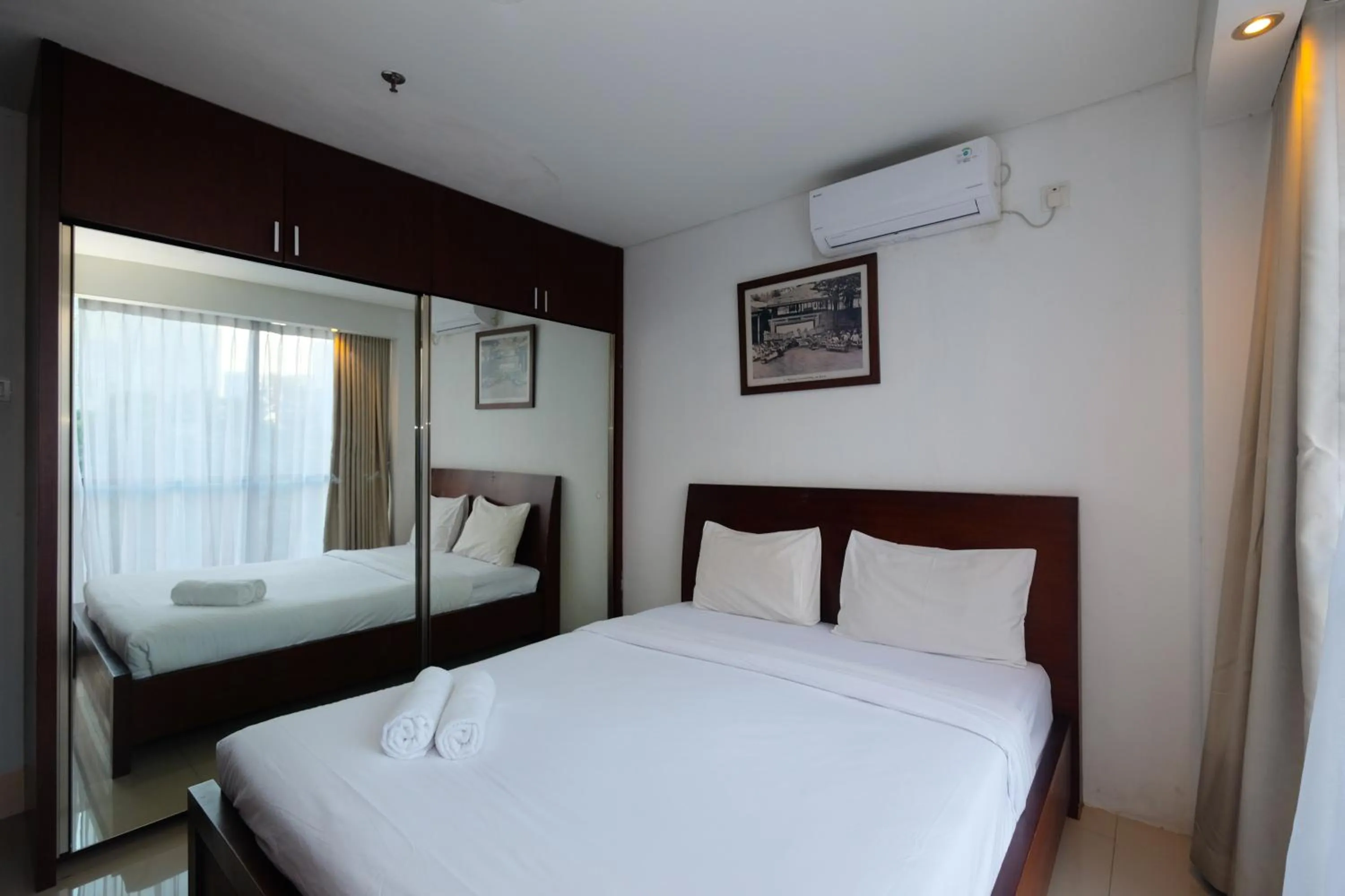 Bed in Best and Homey 2BR Taman Sari Semanggi Apartment By Travelio