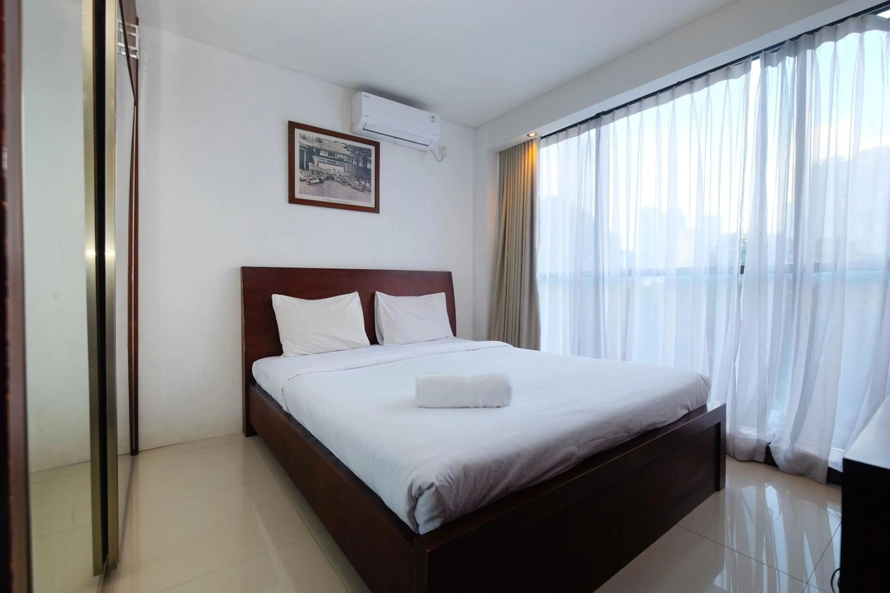 Bed in Best and Homey 2BR Taman Sari Semanggi Apartment By Travelio