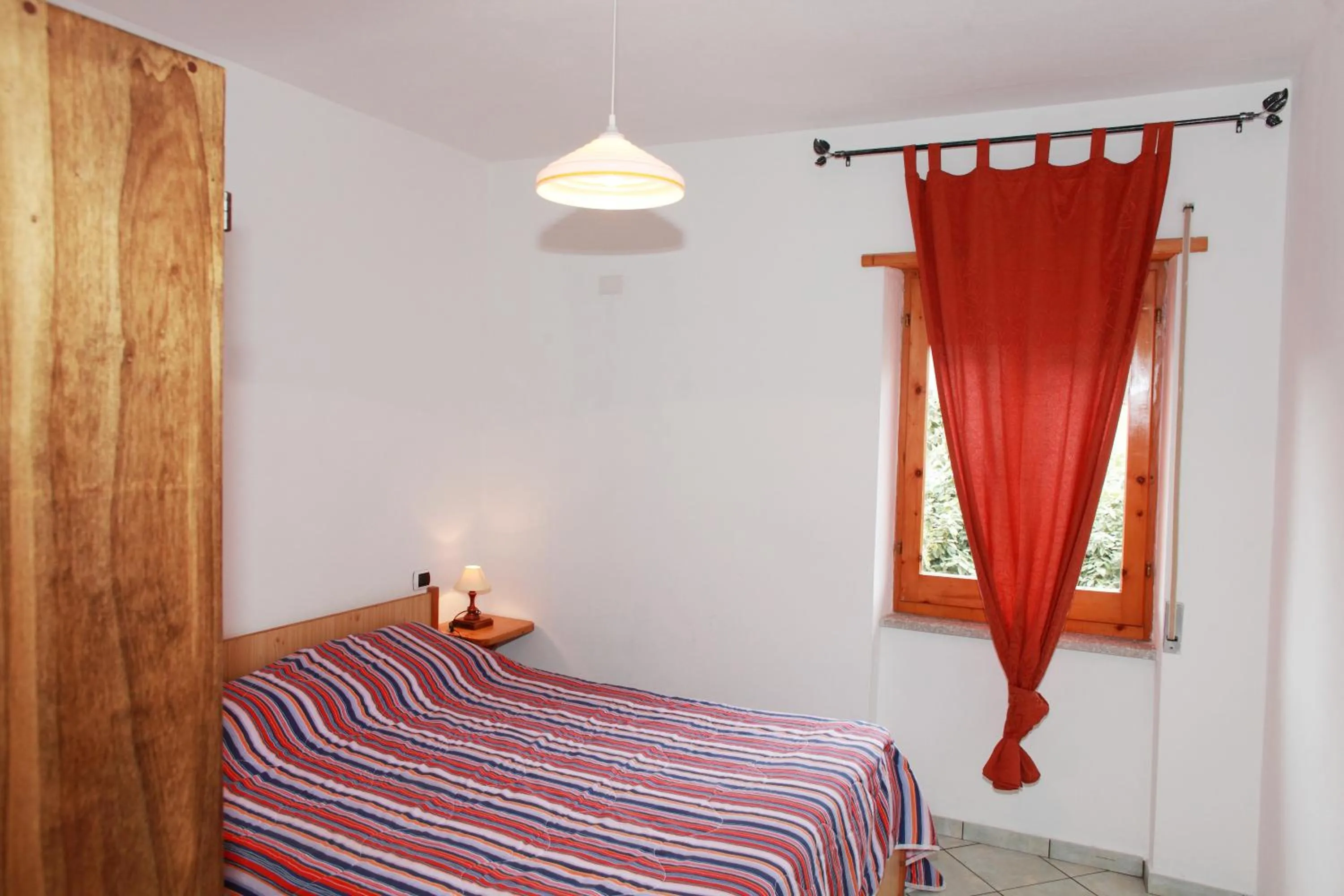 Bedroom, Bed in Appartamenti Mare Blu