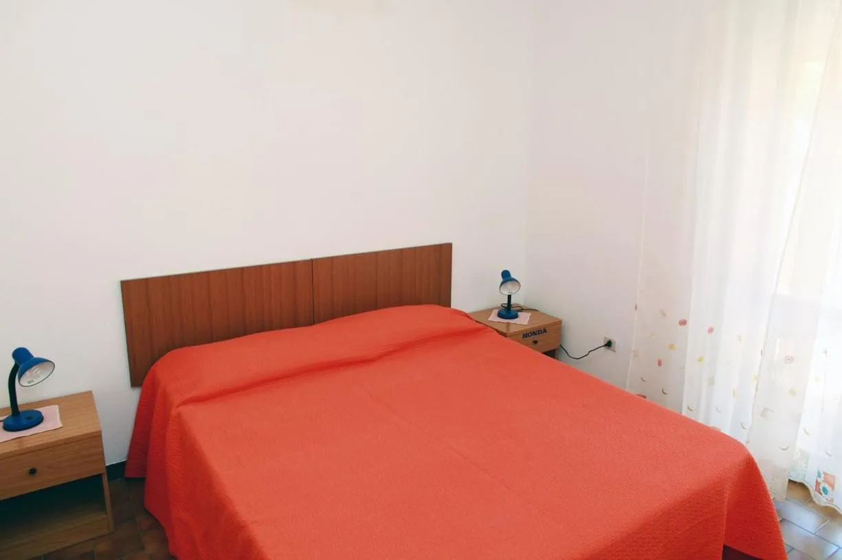 Bed in Appartamenti Mare Blu