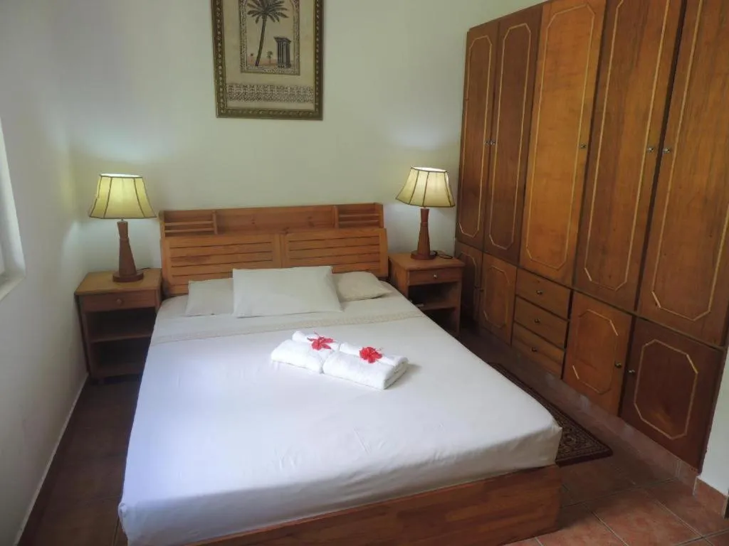 Bed in Reef Holiday Apartments