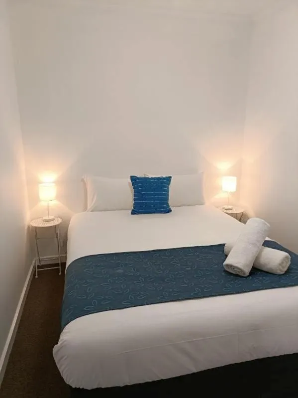 Bed in Waves Motel and Apartments