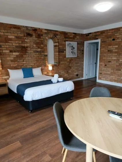 Bed in Waves Motel and Apartments