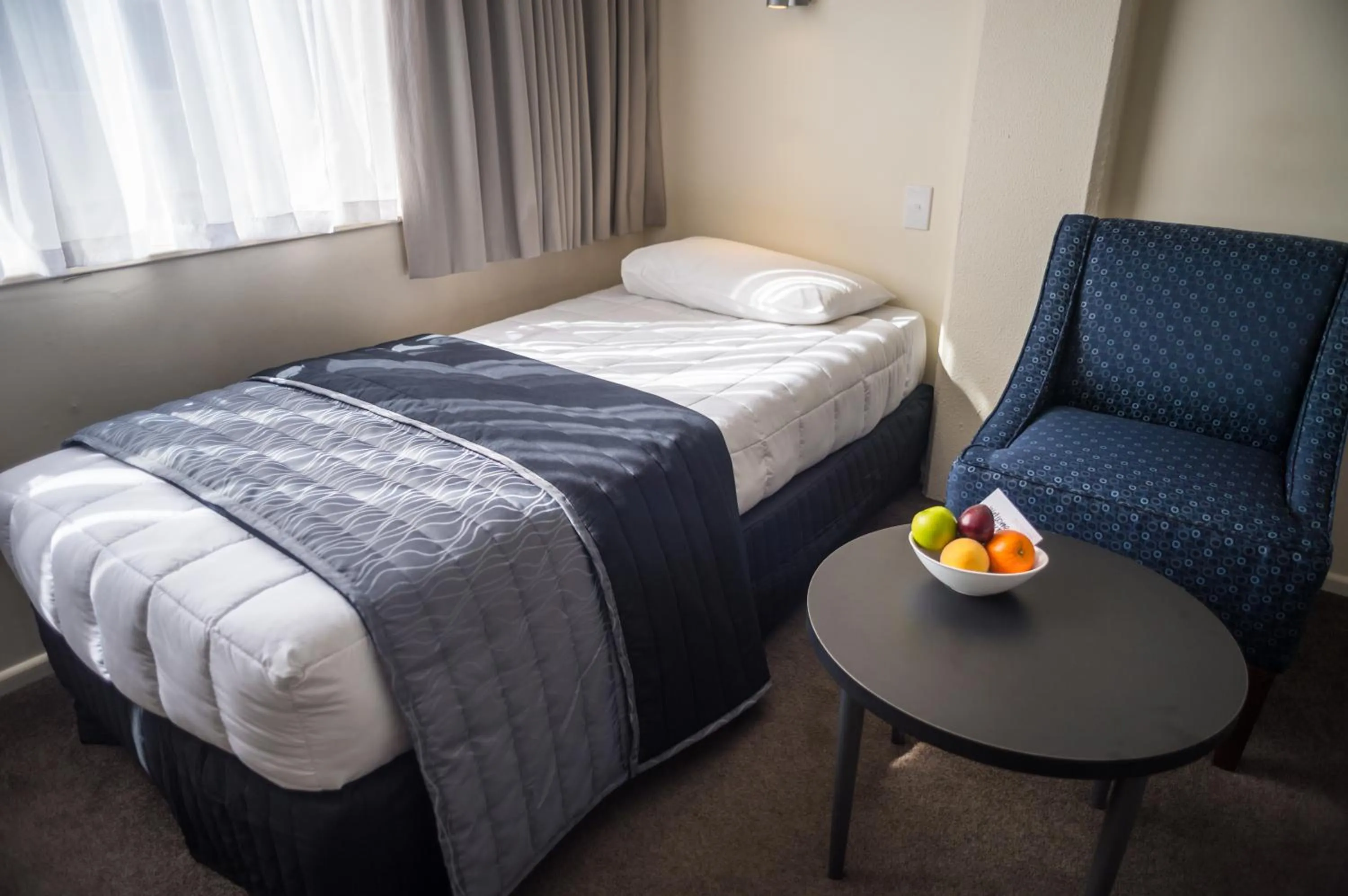 Bed in West Plaza Hotel