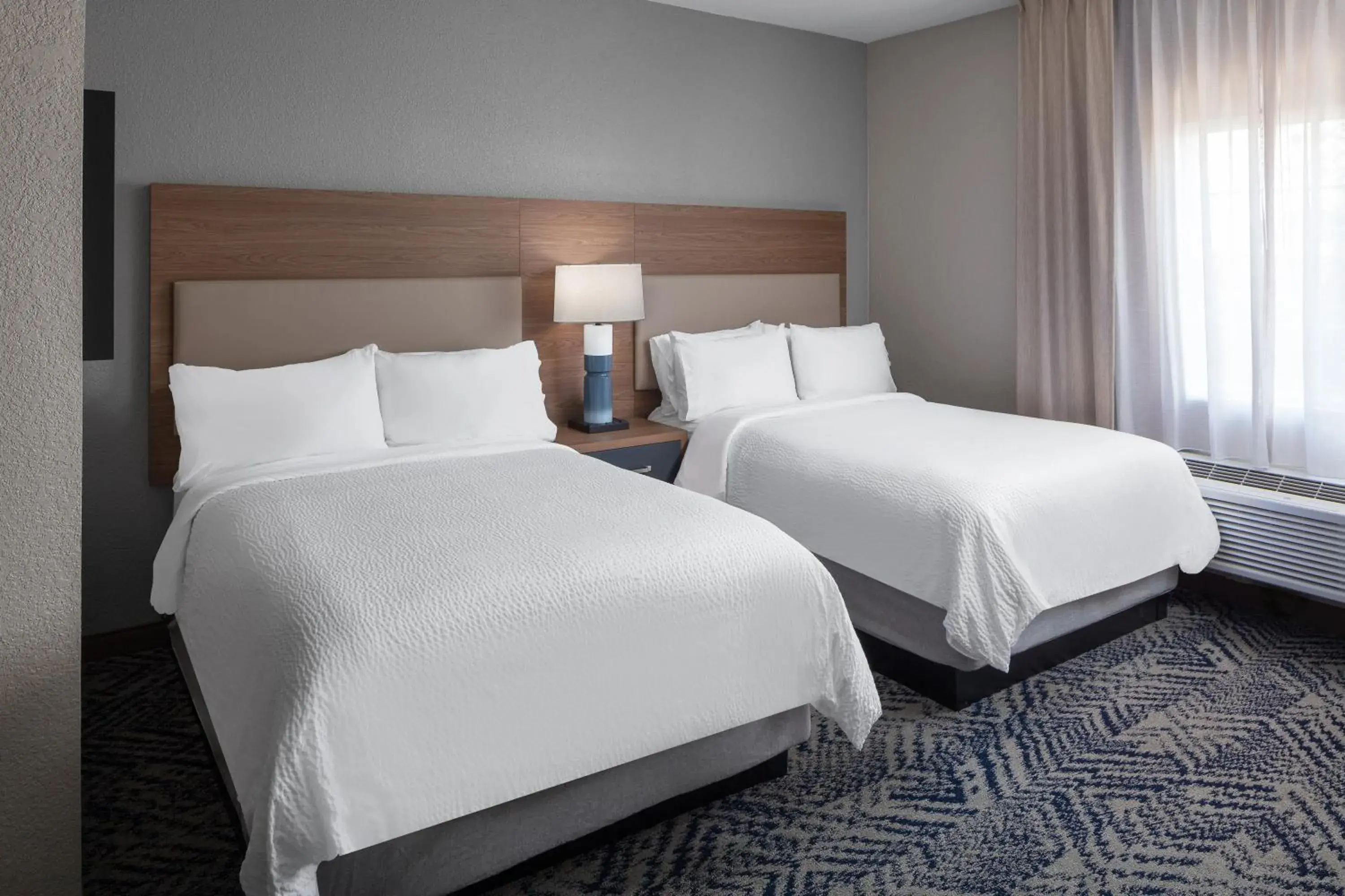 Bed in Candlewood Suites St. Robert by IHG Bed in Candlewood Suites St. Robert by IHG