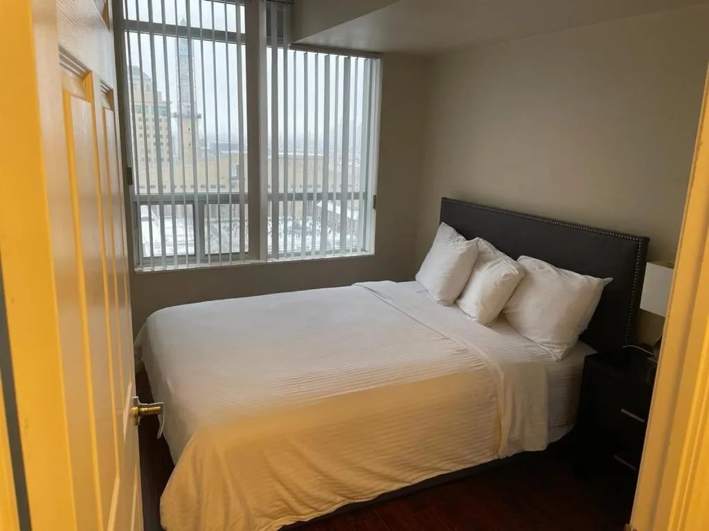 Bed in Platinum Suites Furnished Executive Suites