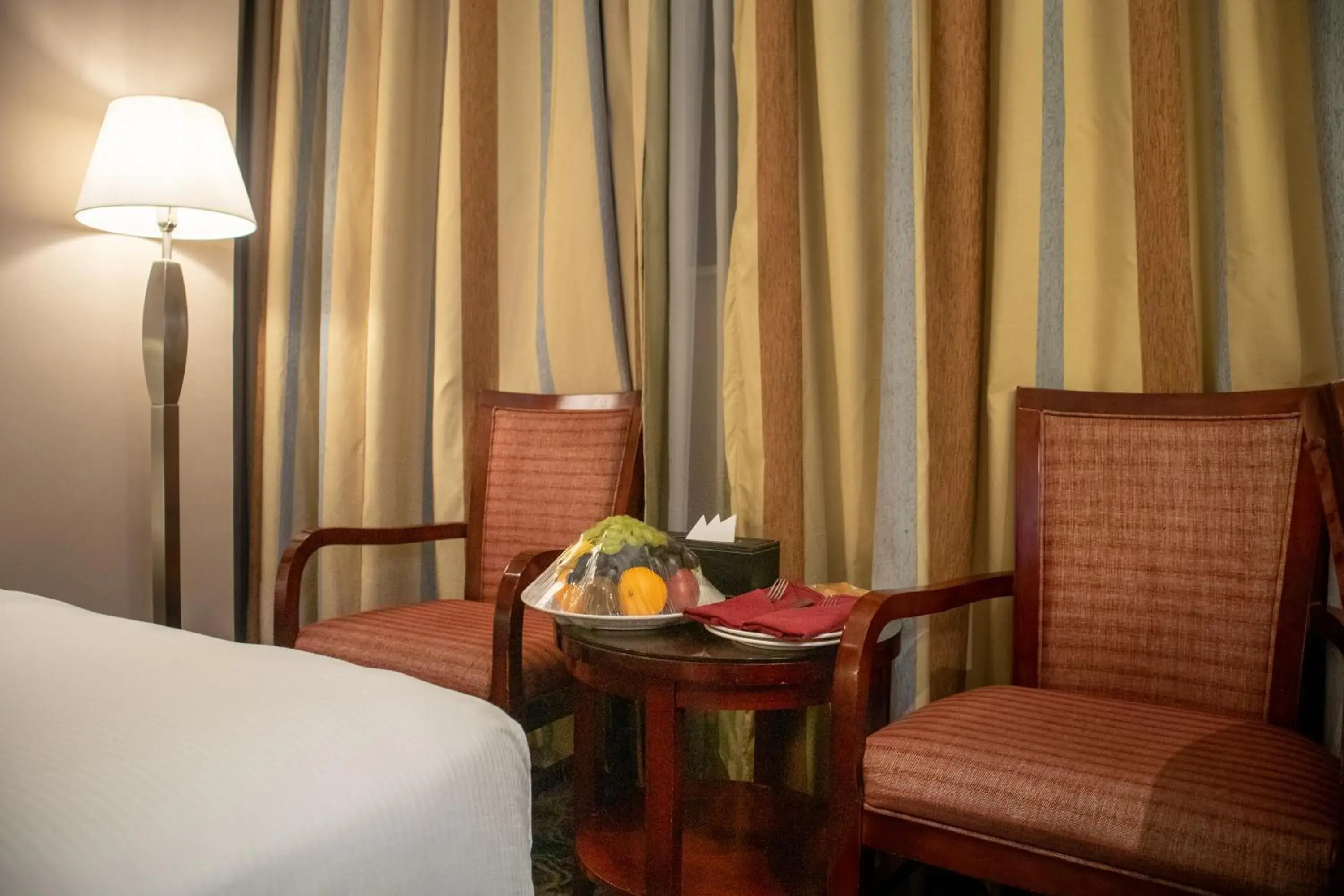 Seating area, Bed in Emaar Royal Hotel Seating area, Bed in Emaar Royal Hotel