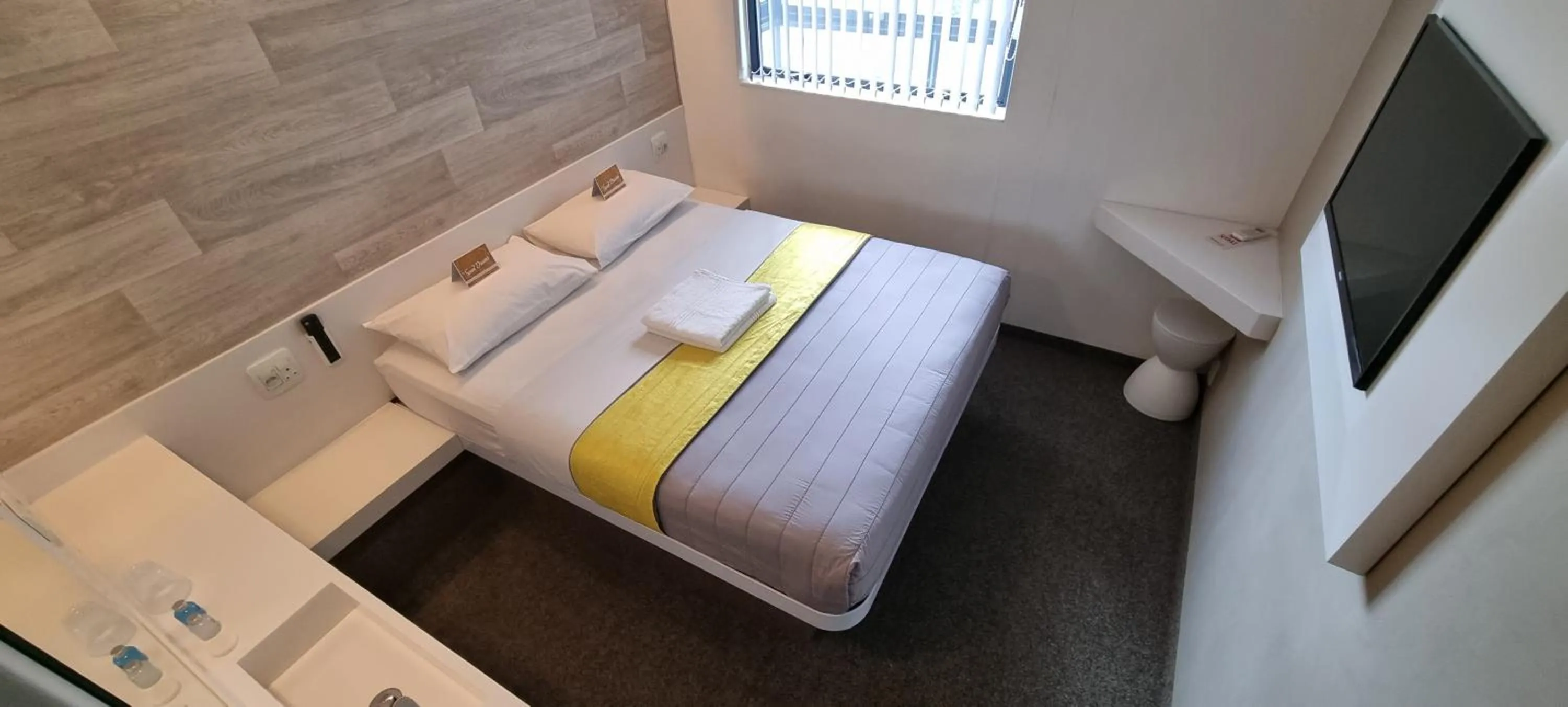 Bed in Check Inn Hotel