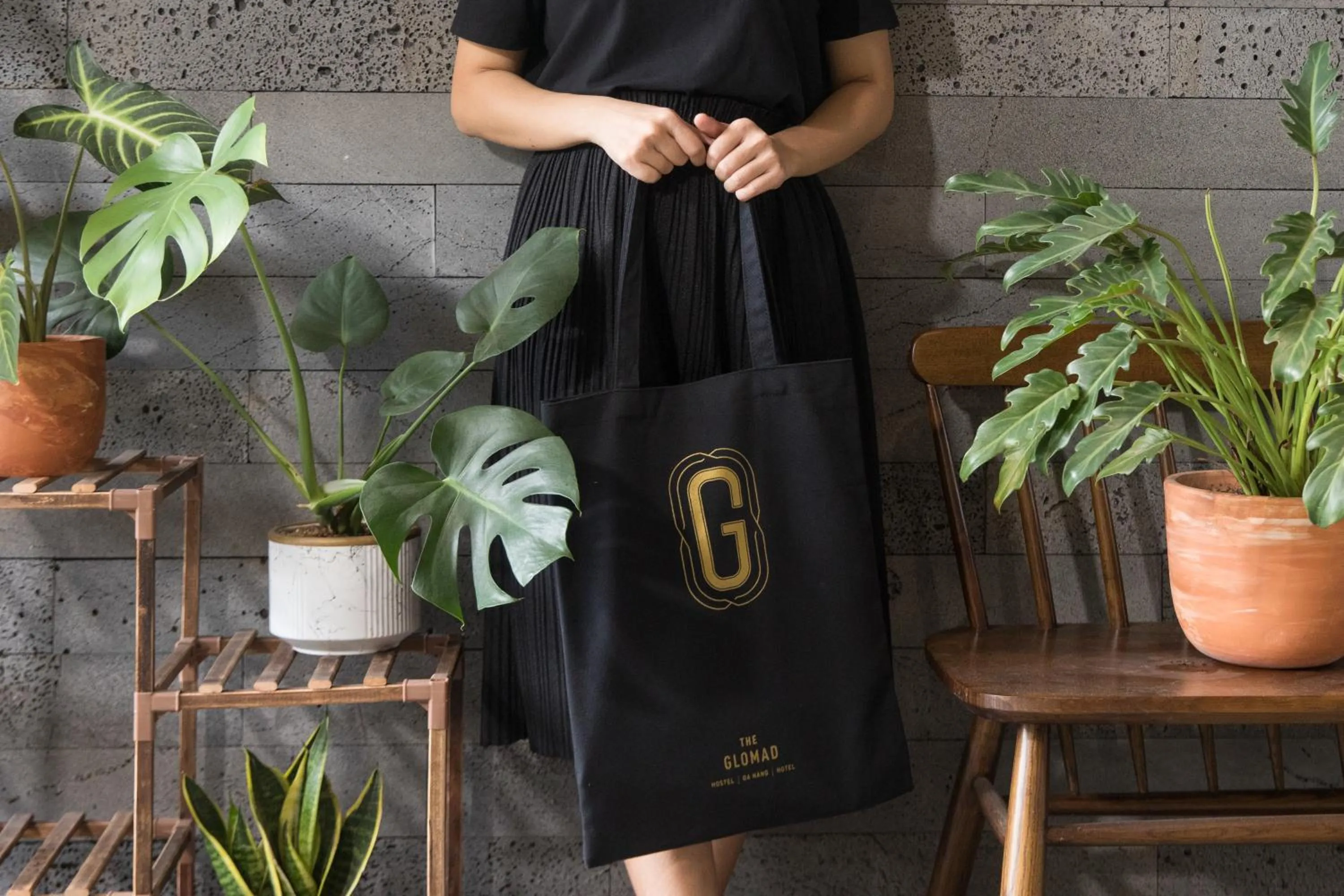 Property logo or sign in The Glomad Boutique Danang