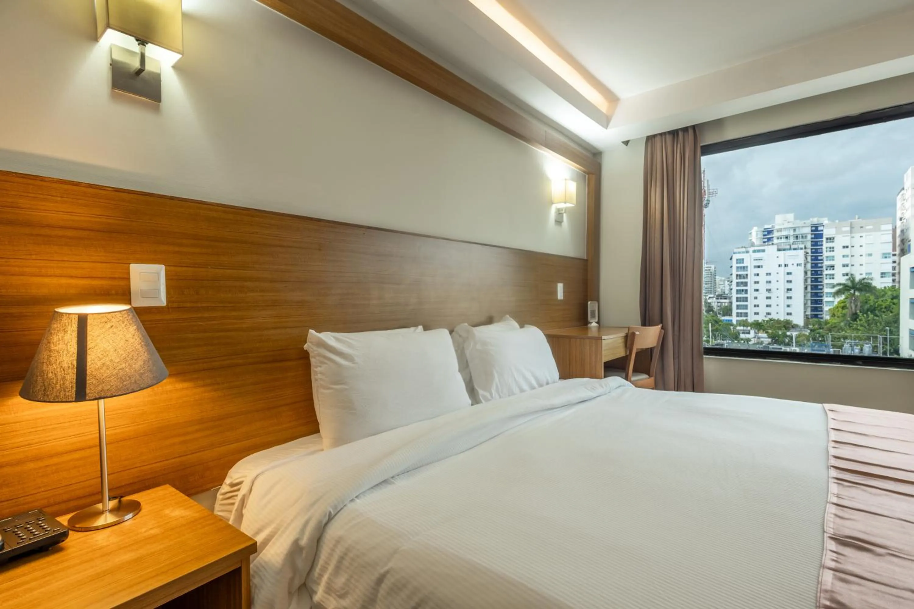 Bed in Weston Suites Hotel