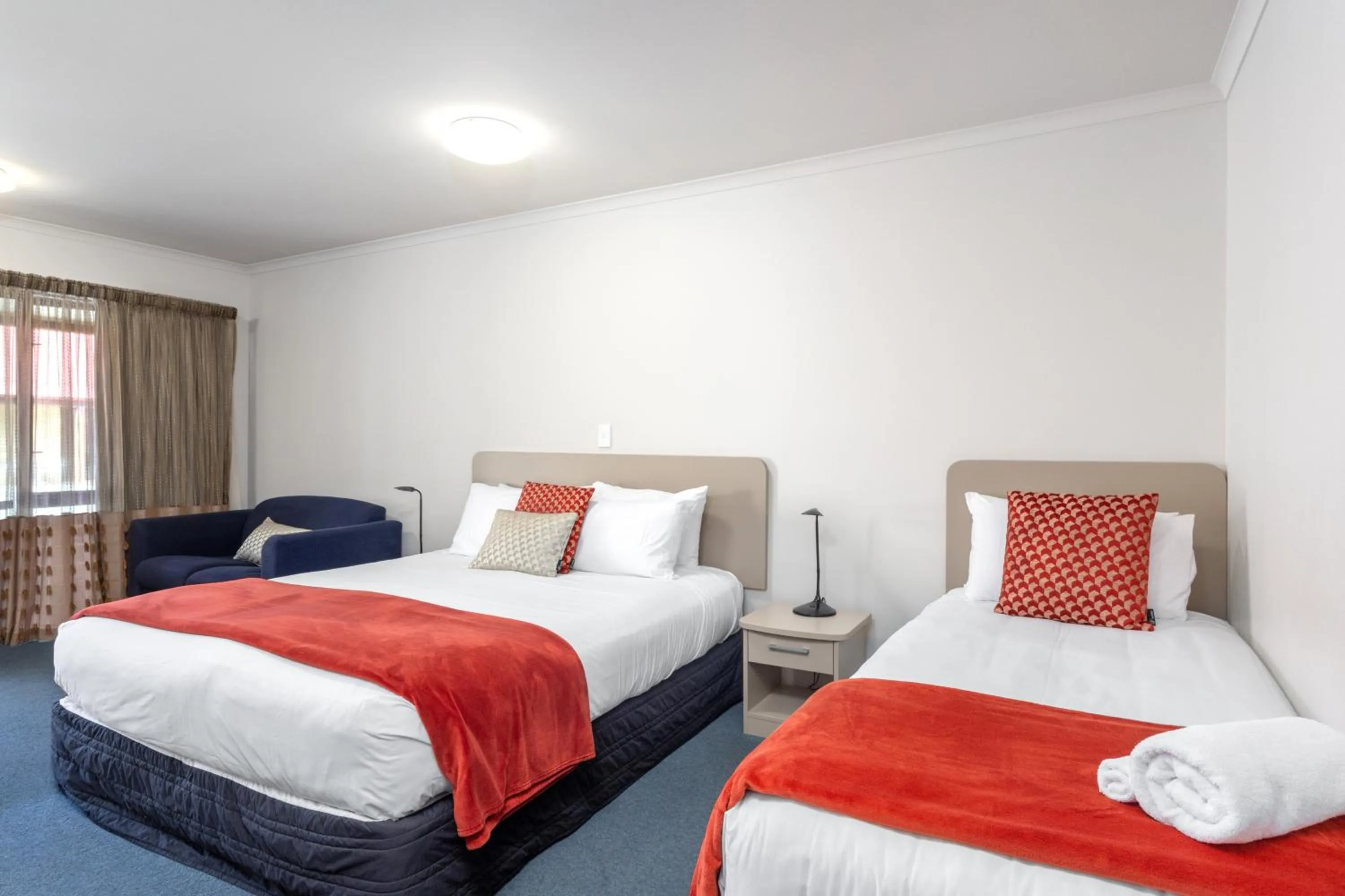 Bed in ASURE Scenic Route Motor Lodge