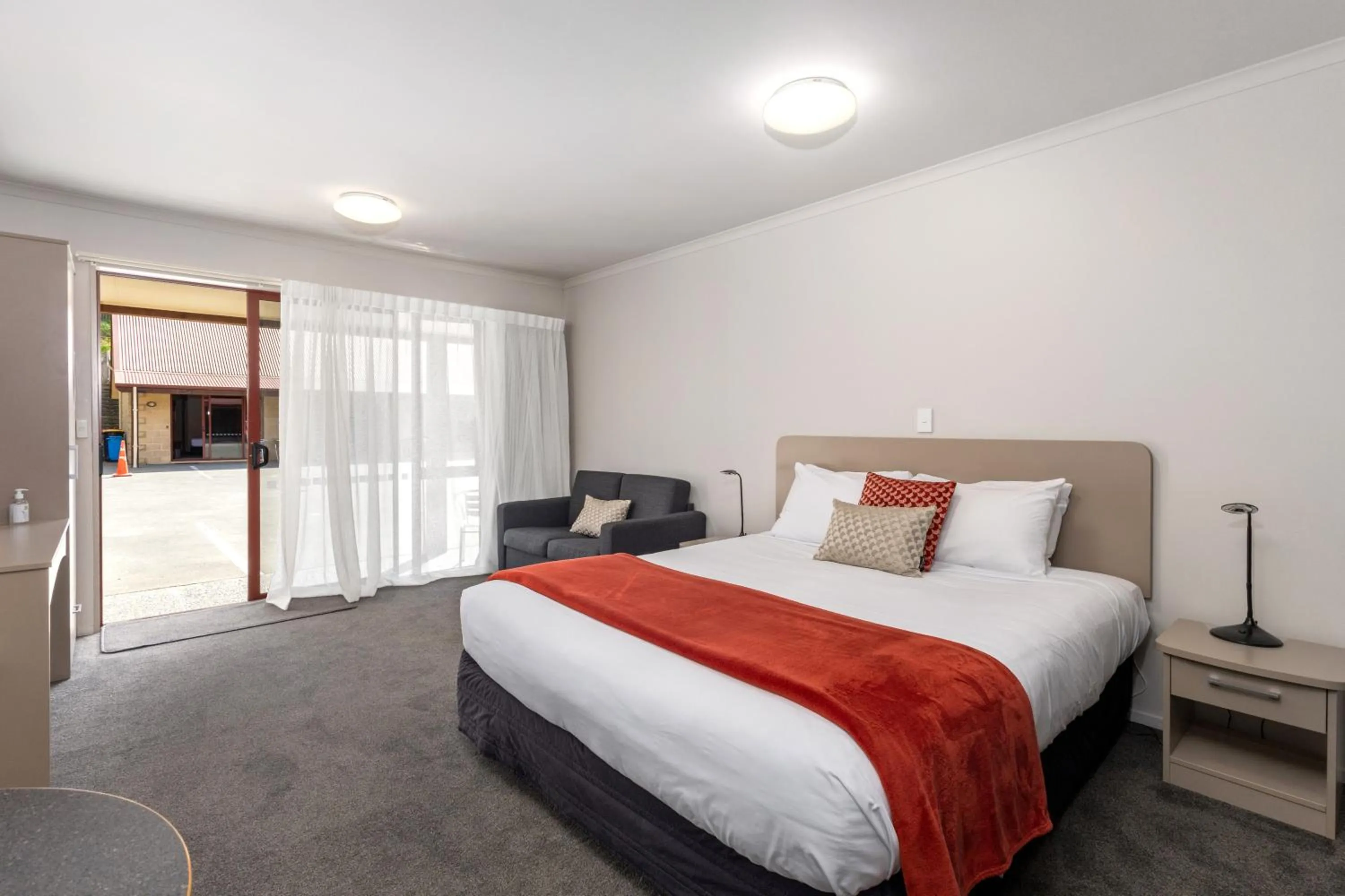 Bed in ASURE Scenic Route Motor Lodge