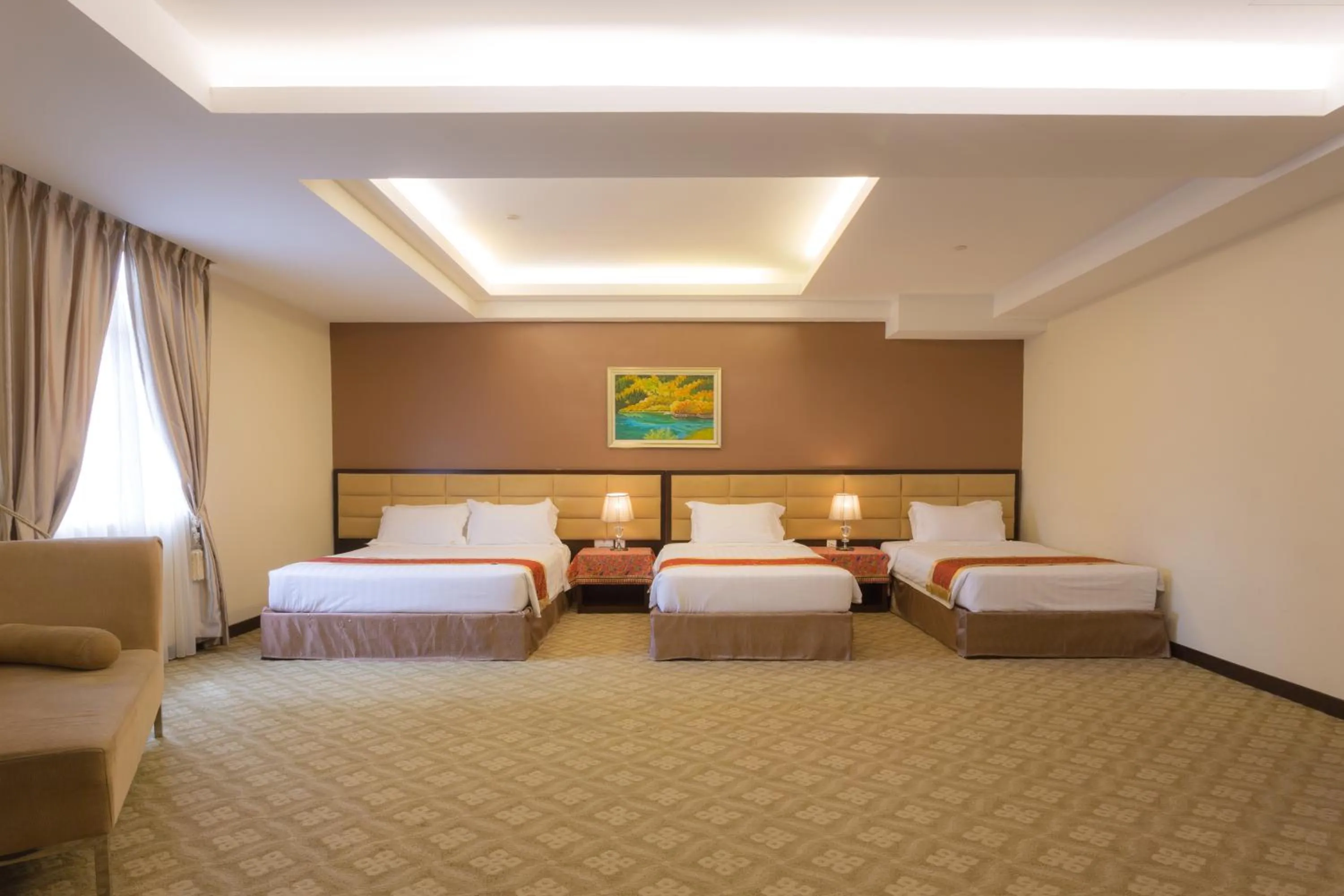 Bed in Hallmark Crown Hotel