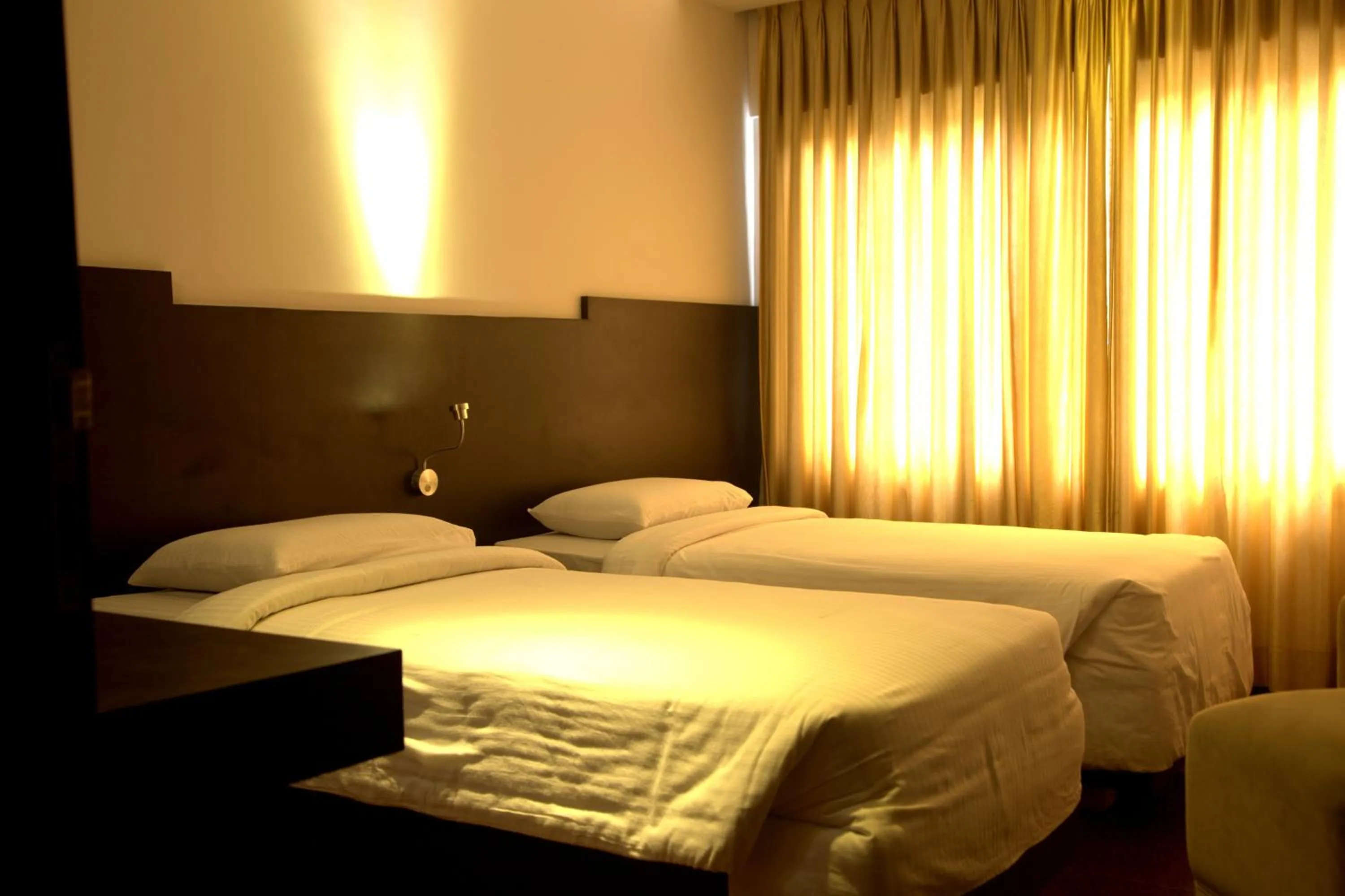 Bed in Hotel Gokulam Park