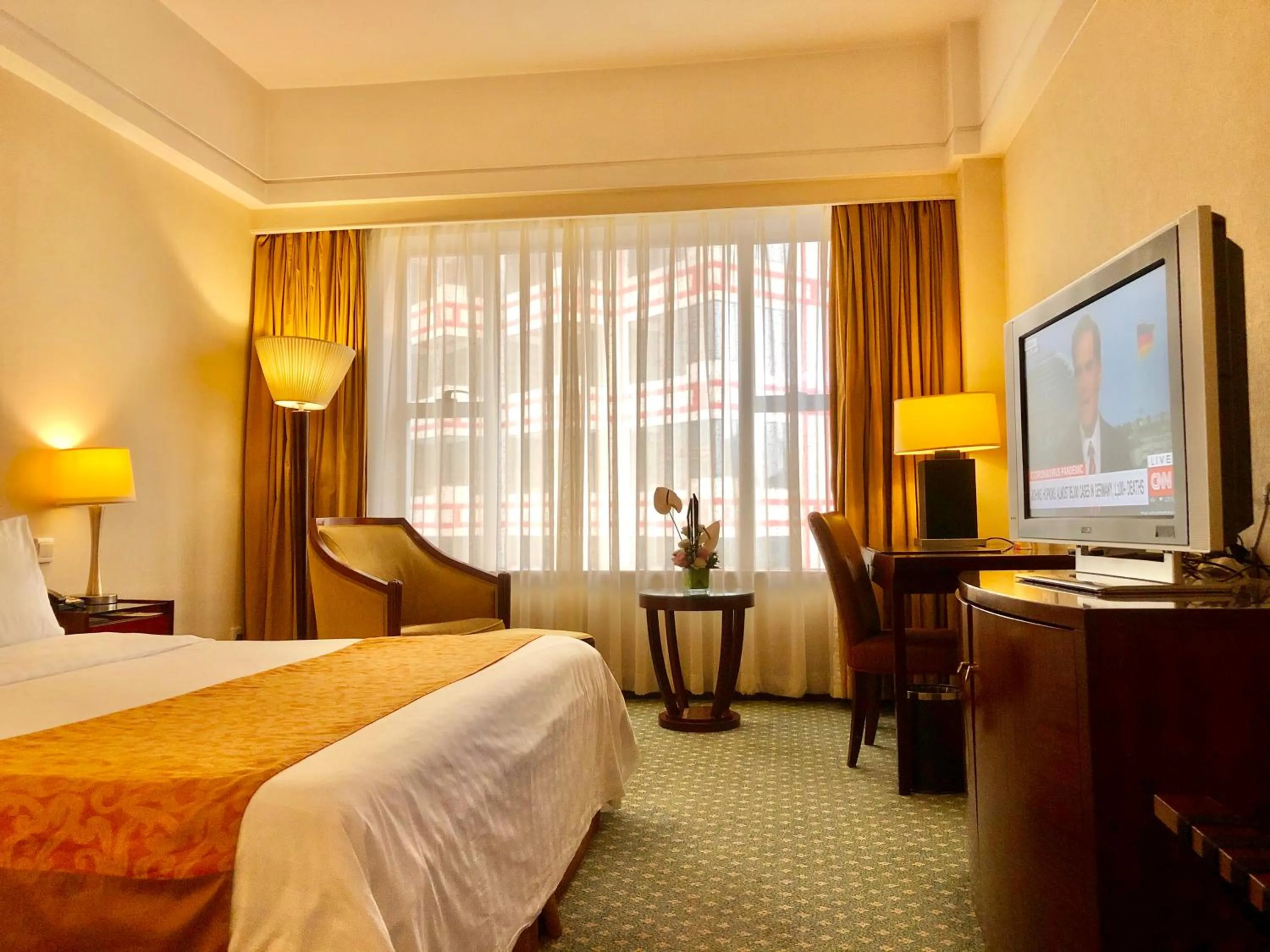 Bed in Ningbo Portman Plaza Hotel