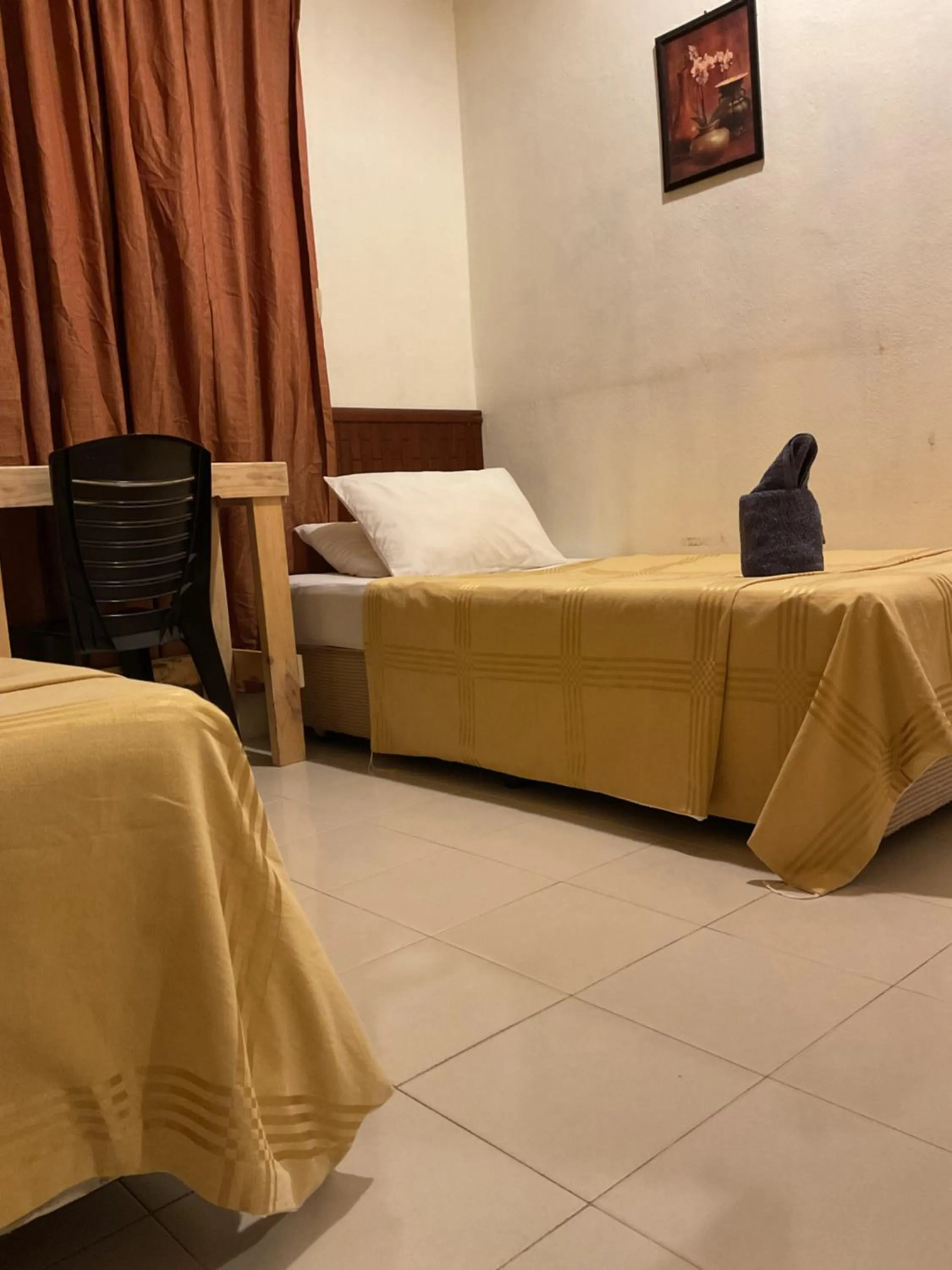 Bed in THE COTTAGE LANGKAWI