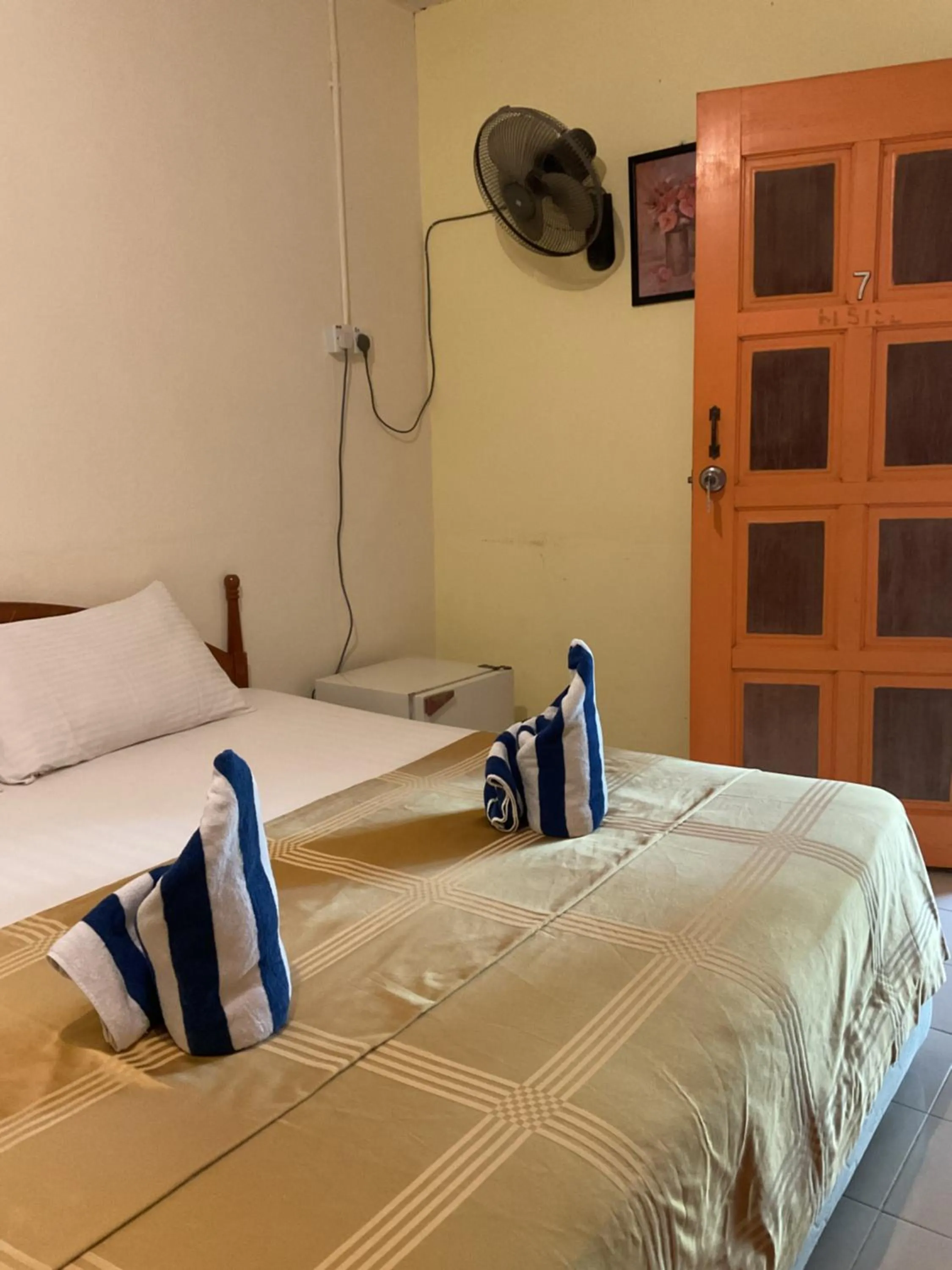 Bed in THE COTTAGE LANGKAWI