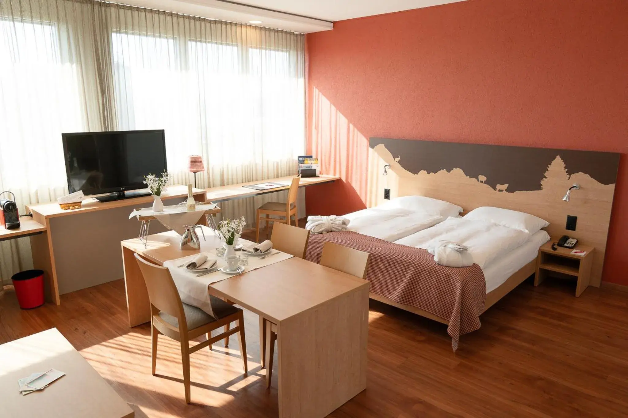Photo of the whole room, Bed in SwissEver Hotel Zug Photo of the whole room, Bed in SwissEver Hotel Zug