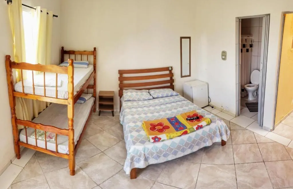 Bed in Pousada Aconchego