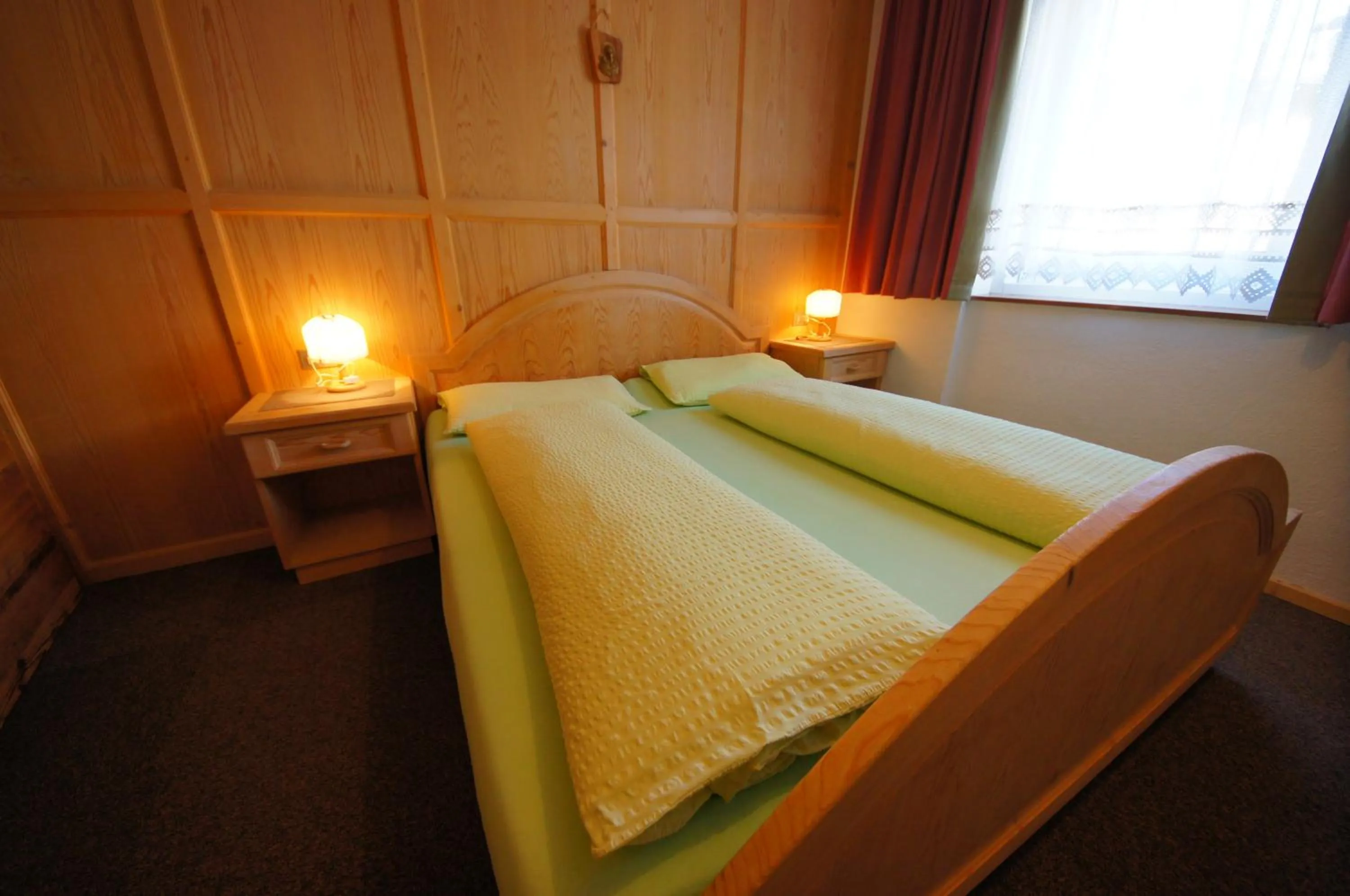 Bedroom in Appartamenti Residence Pars