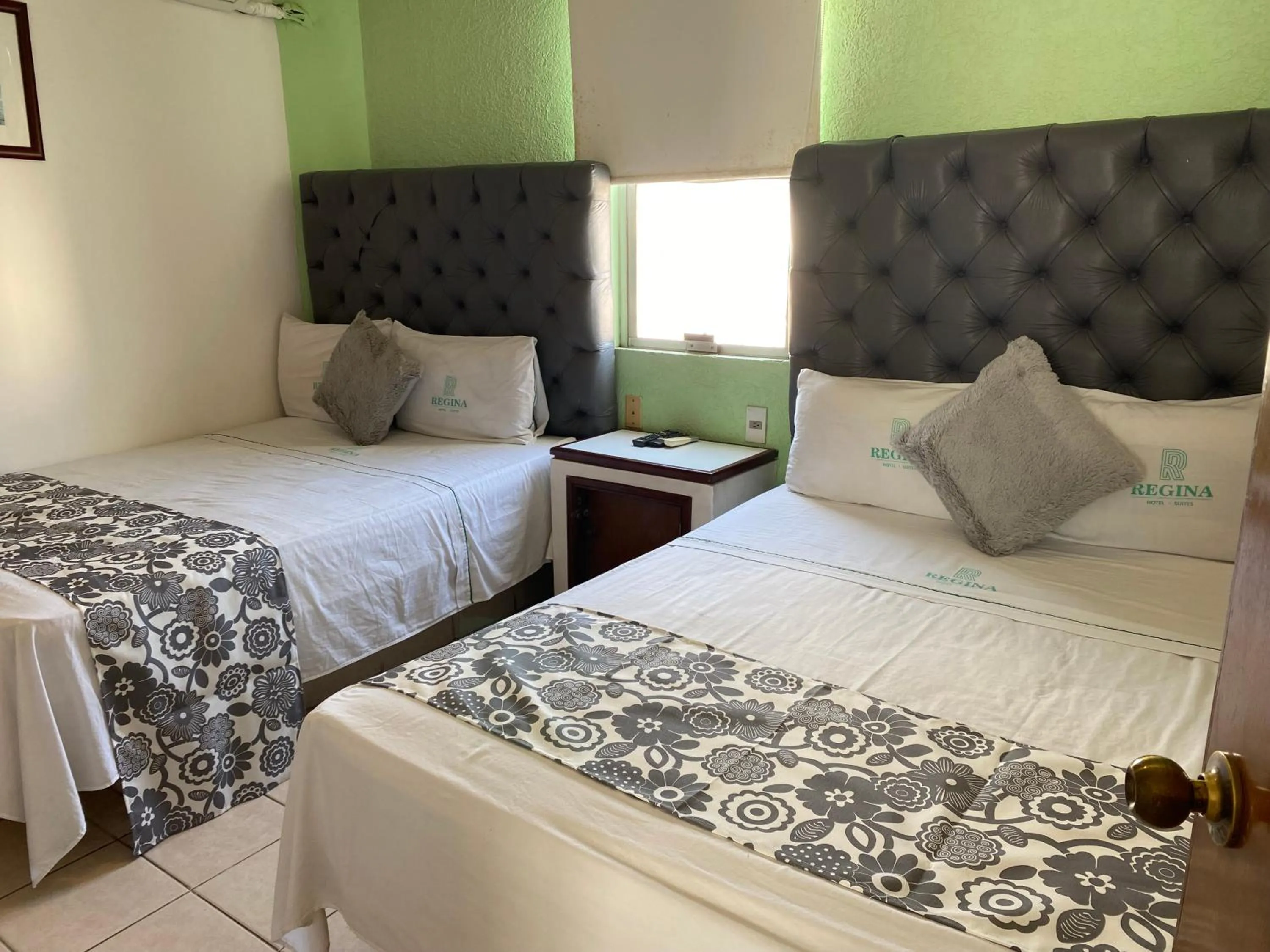 Bed in Hotel Suites Regina