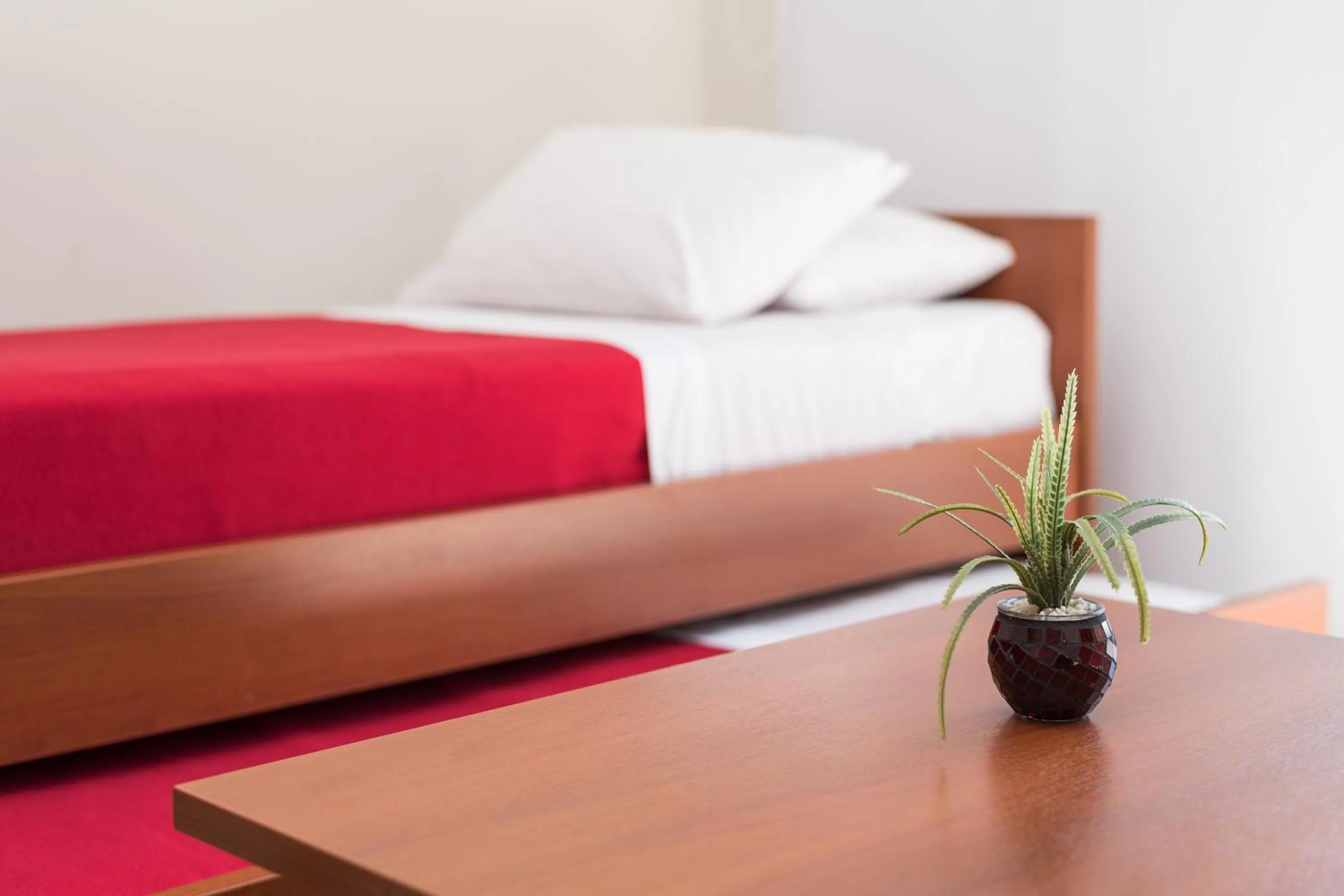 Decorative detail, Bed in Apart Hotel Independencia - Luz y Fuerza Patagonia
