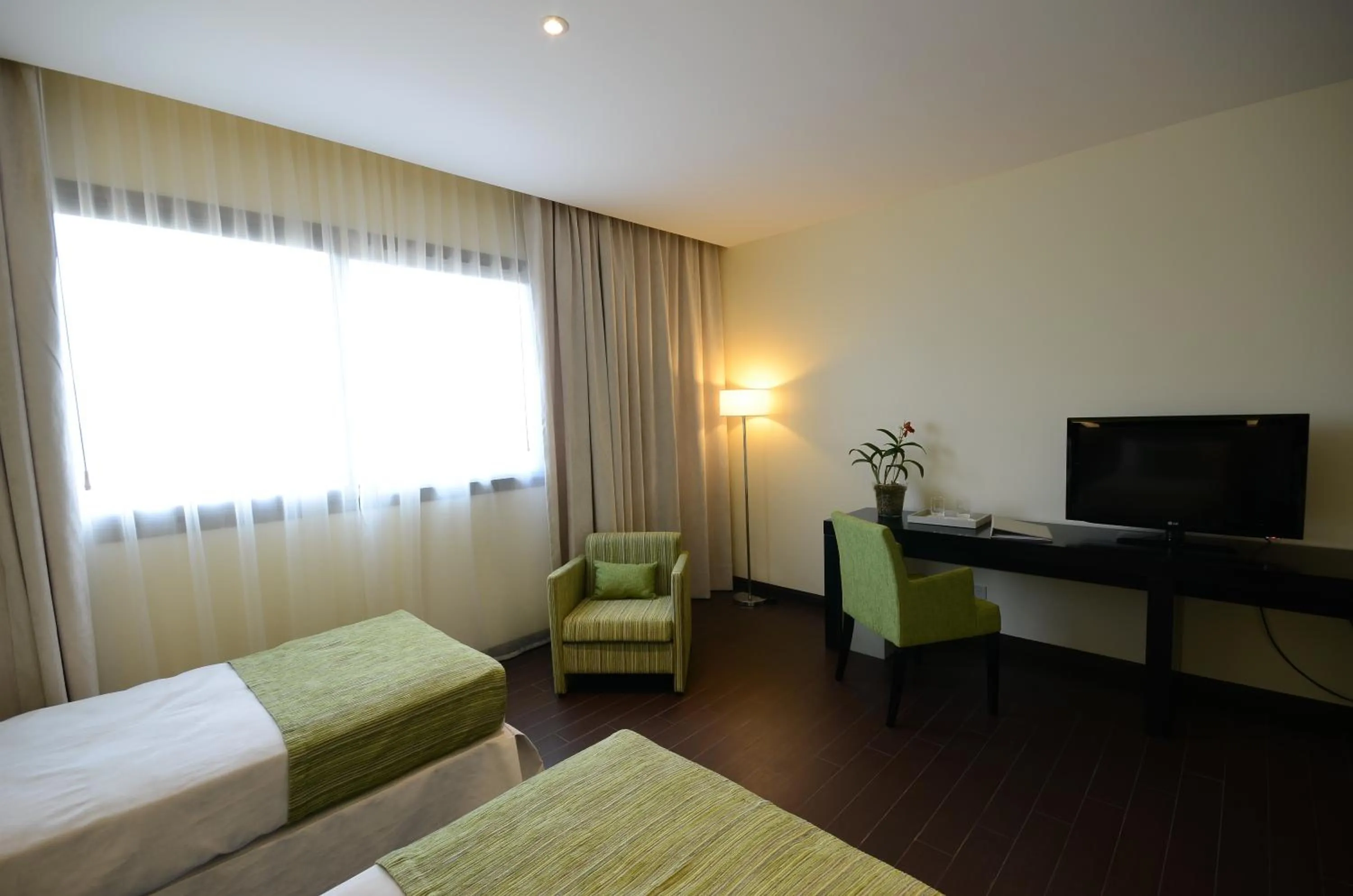 Bed in Grand Crucero Hotel