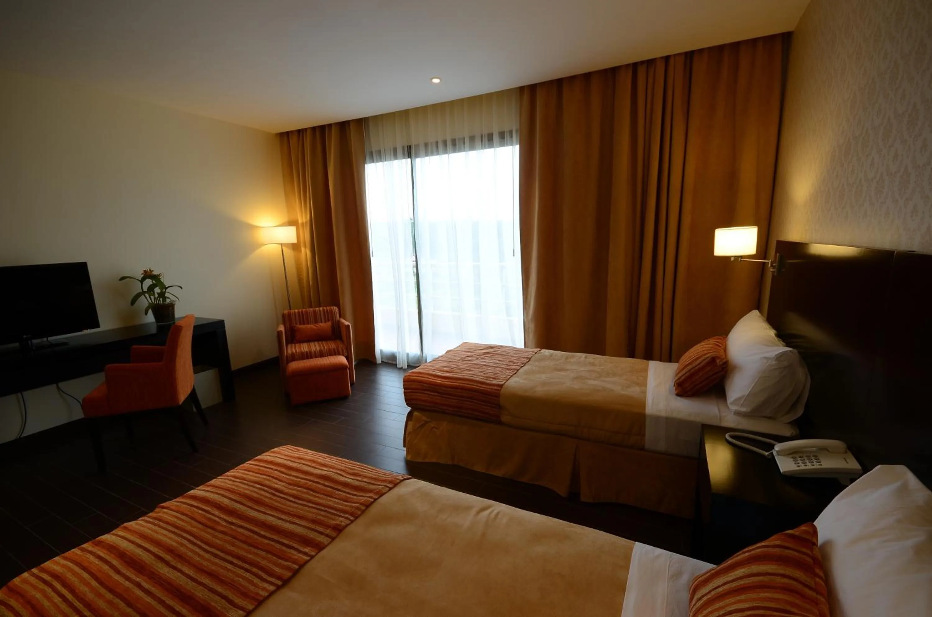 Bed in Grand Crucero Hotel