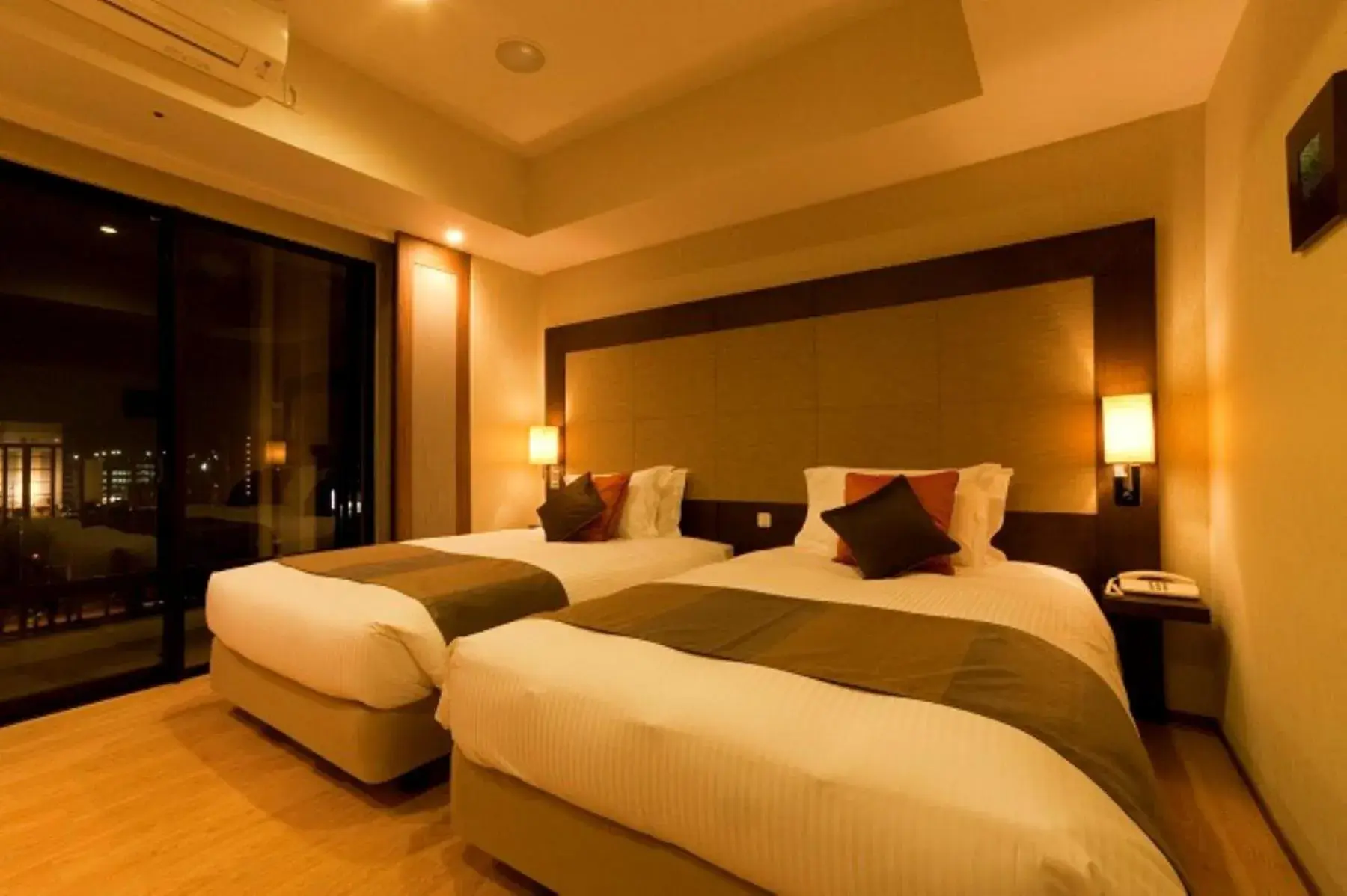 Bed in Moon Ocean Ginowan Hotel & Residence Bed in Moon Ocean Ginowan Hotel & Residence