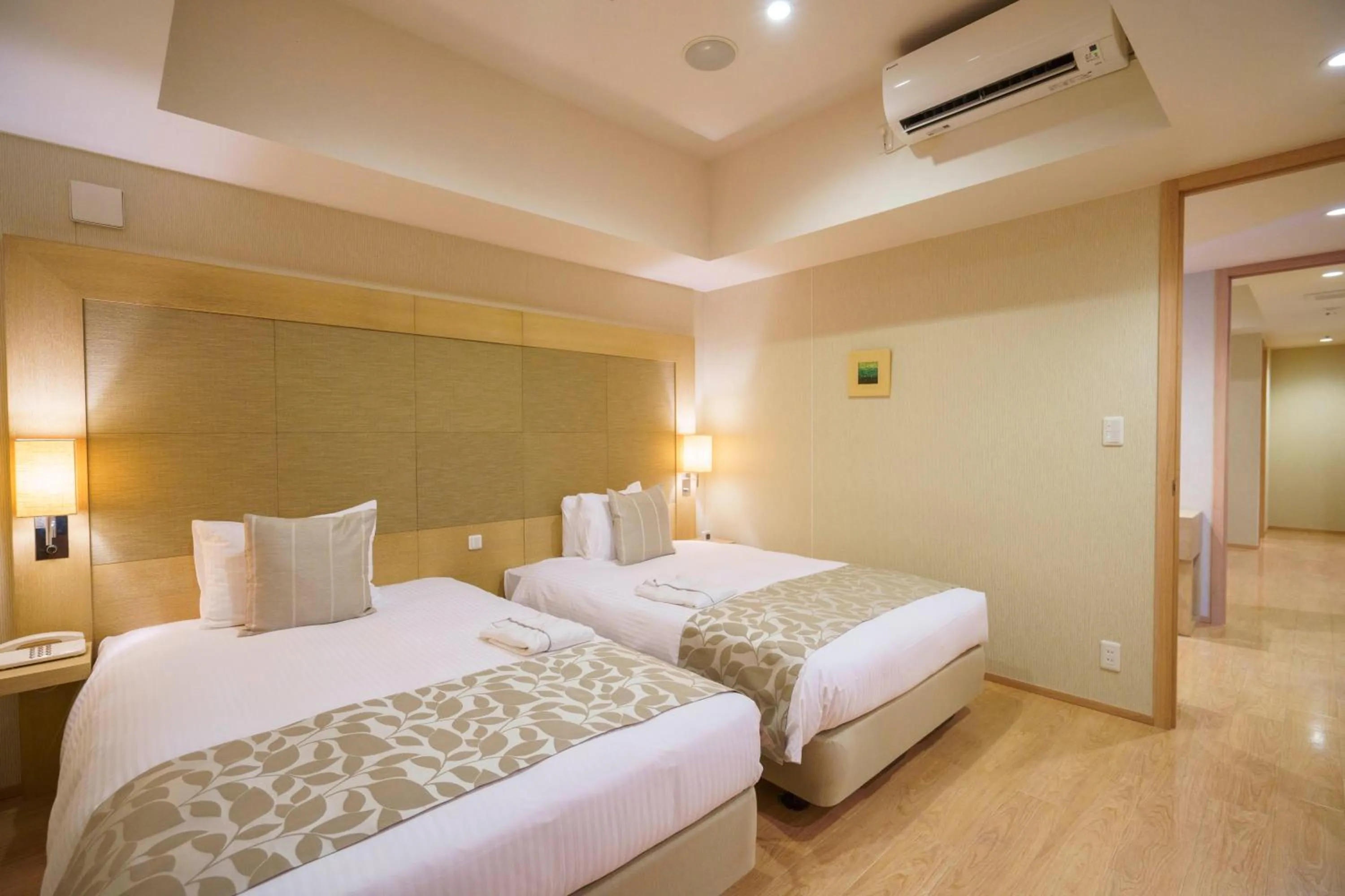 Bed in Moon Ocean Ginowan Hotel & Residence