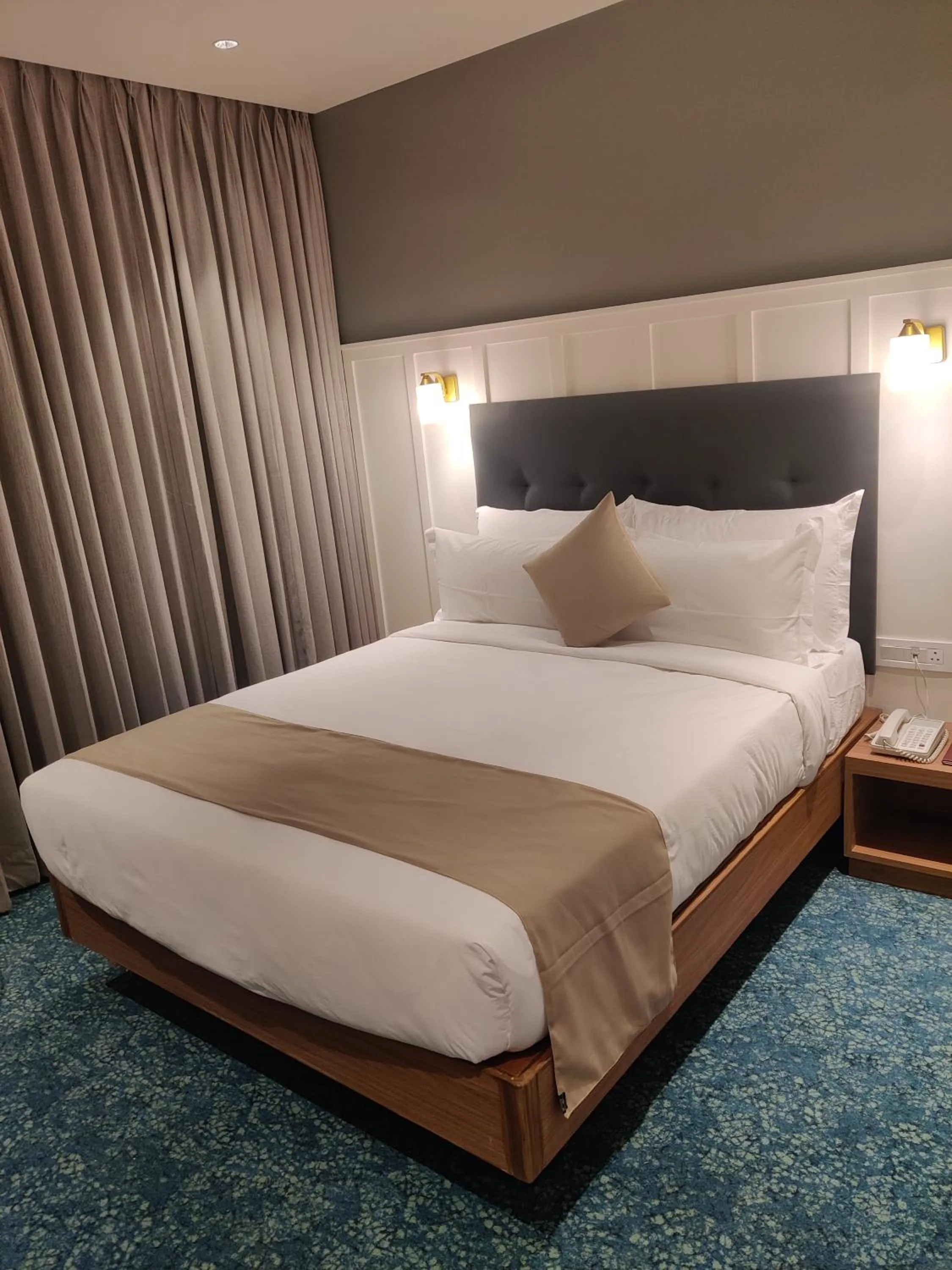 Bed in Chryso Hotels Pvt Ltd