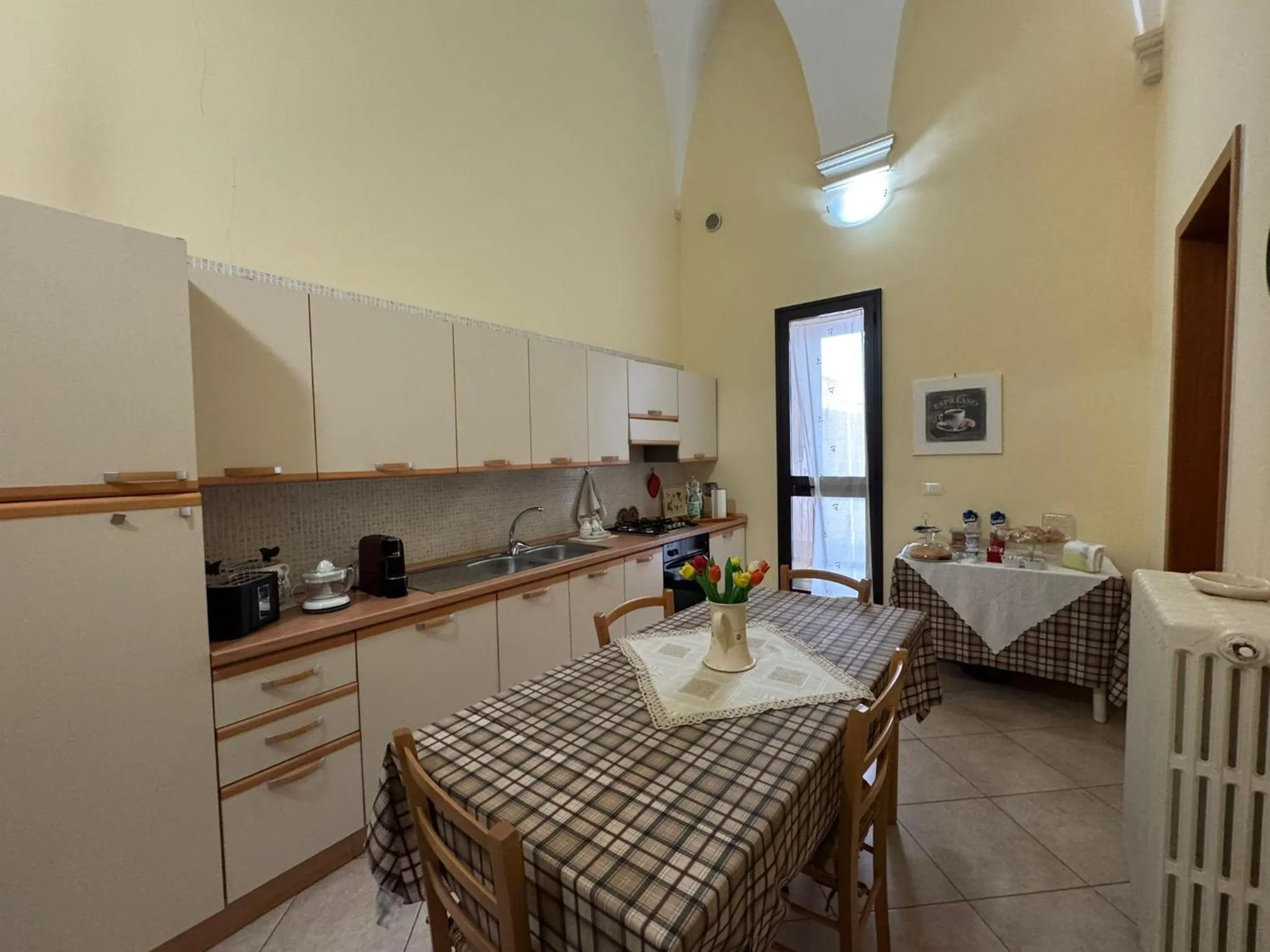 Communal kitchen in B&B La Corte